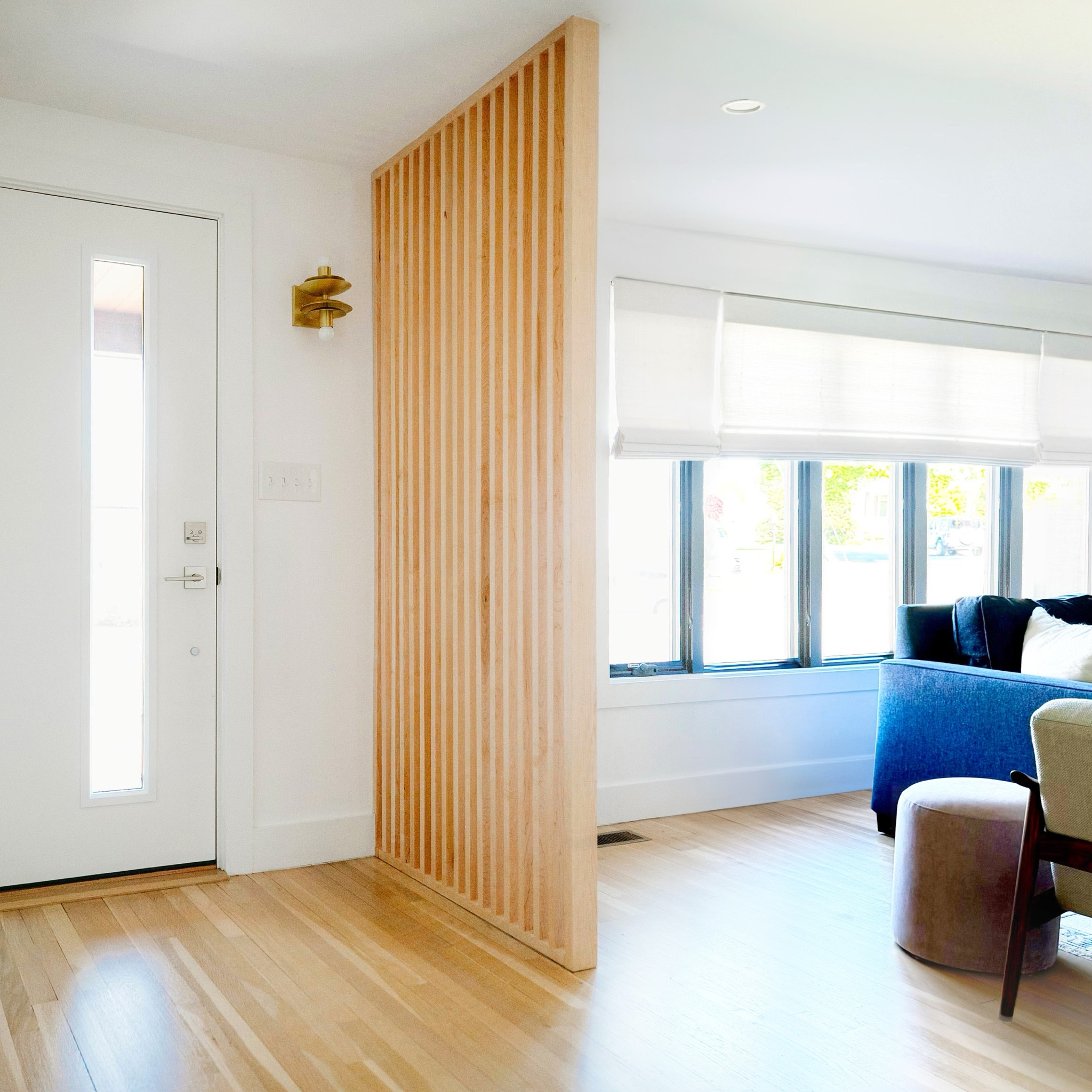 although this one level house looked small from the exterior, it was deceivingly large on the inside, with spacious rooms and a great floor plan. the front door opened into the living room and featured a floor-to-ceiling divider that created a separate entry area with a coat closet. inspired by the original fixture, #dwelloctoberstudio added a custom-built divider made from vertical wood slats to differentiate the living room from the entry, while still allowing the natural light to flow through. an unlacquered brass sconce by the front door also pays tribute to the house’s mid-century modern roots. #dwelloctoberrealestate #dwelloctober

#LTKHome