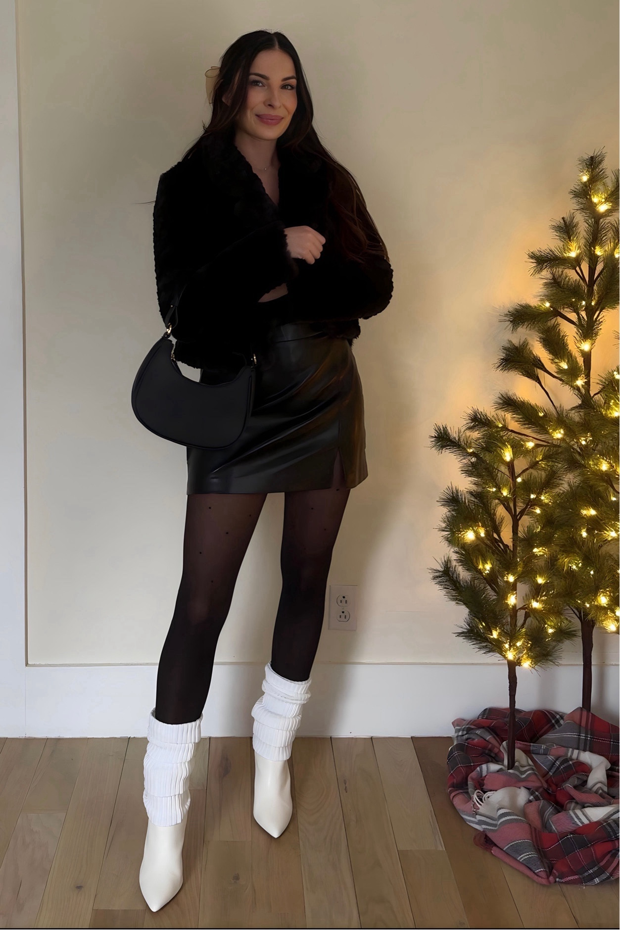 Cheers to a year of chasing dreams and rocking killer outfits! This NYE look is just the beginning, the best is yet to come. 🪩✨ what texture are you bringing into your NYE outfit? Feathers, sparkles, fur, leather?! 

Black leather skirt, white leg warmers, black cropped faux fur jacket, black eyelash sweater, black tights, white booties, NYE party outfitt

#LTKparties #LTKfindsunder50 #LTKHoliday