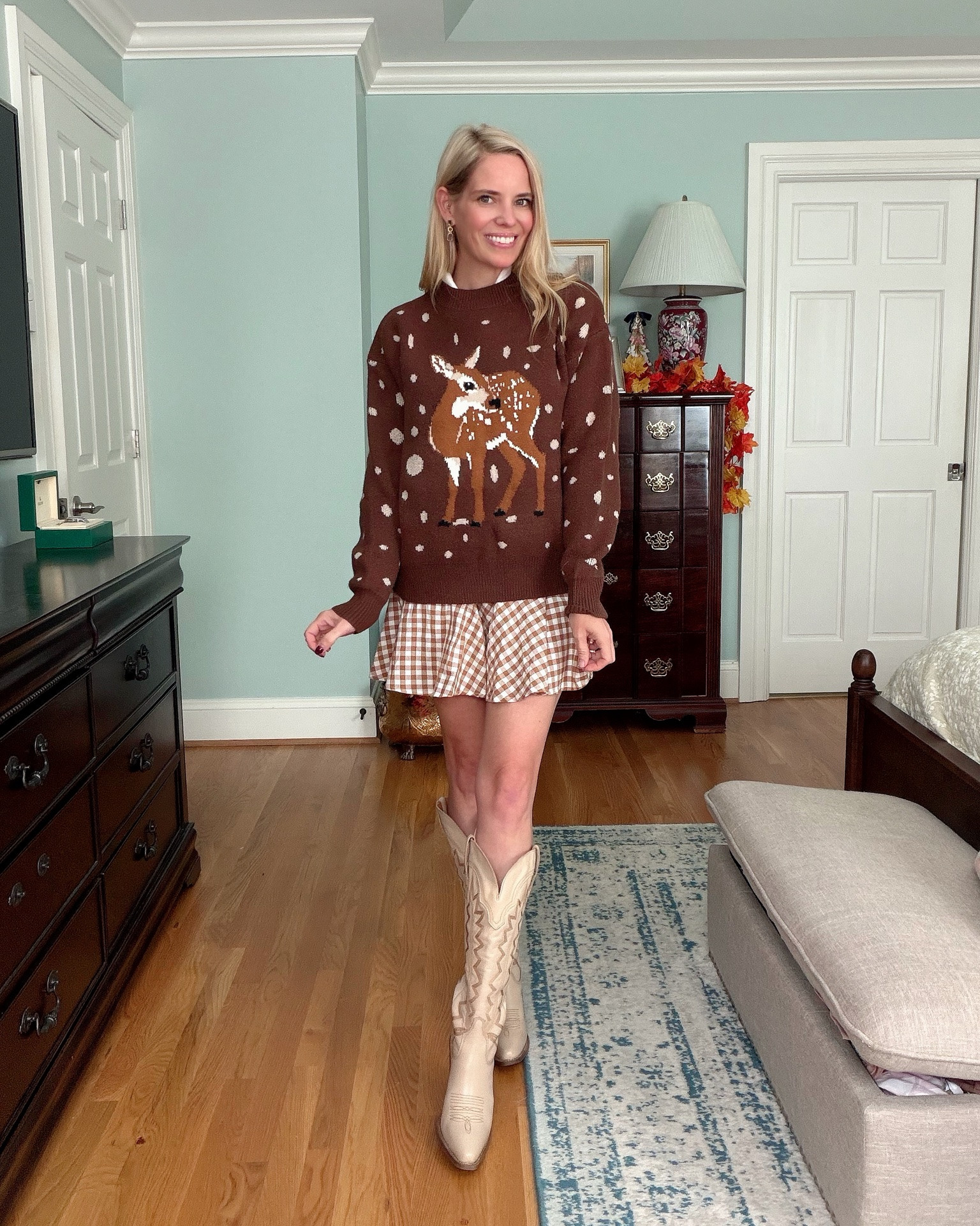 🦌 Gingham + Cozy Deer Sweater

Two ways to style one adorable gingham dress! 🤎🍂 I’m loving this brown-and-white gingham mini dress with my cream Western boots for an easy fall transition look. Then I layered on the cutest cozy deer sweater for a festive fall outfit! 🦌🤎✨

The dress has the sweetest collared neckline and flouncy hem, while the deer sweater adds the perfect cozy touch. Wear them separately or layer them together for a fun, preppy fall look!

Gingham mini dress, brown gingham dress, collared mini dress, deer sweater, fall sweater outfit, cute fall outfits, fall transition fashion, Western boots outfit, cream cowboy boots, preppy fall style, Southern style, women over 40 fashion, cozy fall outfit, Thanksgiving outfit ideas, festive fall fashion 🤎🍂🦌✨

#LTKOver40 #LTKSeasonal #LTKootd