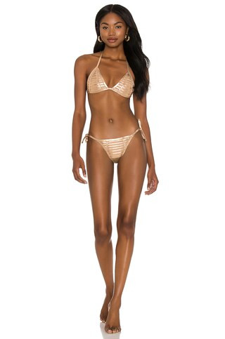 Beach Bunny Hard Summer Side Tie Bottom in Gold from Revolve.com | Revolve Clothing (Global)