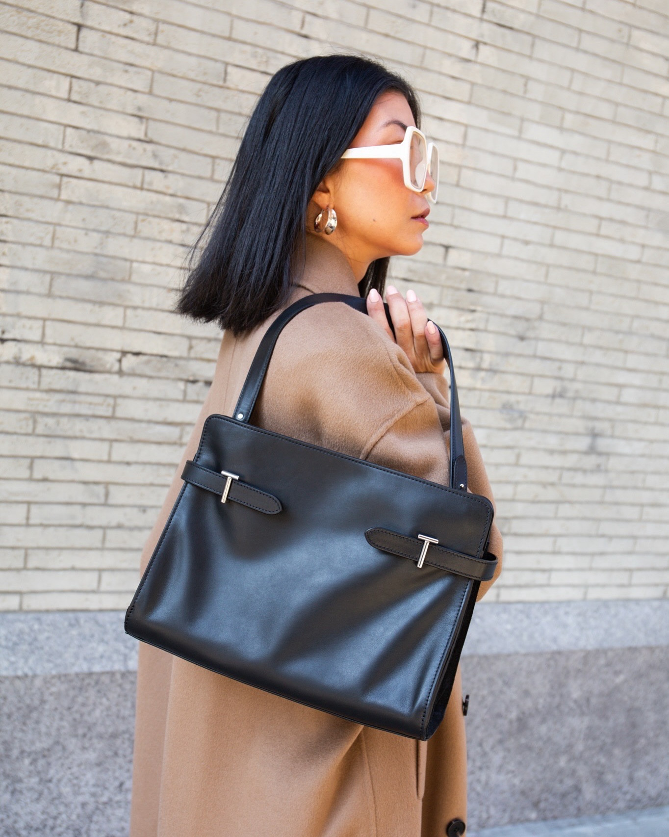 Large bi-material tote bag with signature T clasps and jacquard anniversary lining. Le Tanneur branding and silver finish metallic elements. Can be carried by hand or worn over the shoulder or crossbody thanks to its adjustable and detachable shoulder strap. Detachable second shoulder strap. @letanneur #letanneur #blackbag #totebag #ltkitbag #parisianchic



#LTKStyleTip #LTKSeasonal #LTKItBag