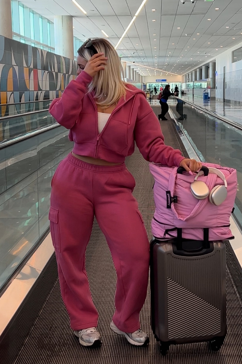 Feeling berry comfy for my flight in my berry pink matching set from Aritzia! #airportoutfit #aritzia #sweats #midsize 

#LTKTravel #LTKFitness #LTKActive