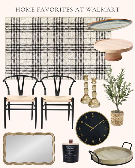 Home decor and furniture favorites at Walmart. Home furnishings. Mid century metal dining chairs. Ceramic oval platter. Rubber wood cake stand. Artificial olive tree in a natural woven rattan basket. Glass candle stick holders. Black plaid area rug. 20” round black and gold clock. Scallop wood wavy wall mirror. Round wood and metal tray. Salted honey and vanilla jar candle  

#LTKhome