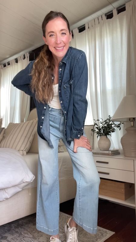 Denim on denim but make it springy! These light colored sailor jeans are a favorite. They fit true to size and are the perfect color for spring. 
The white tank has the most beautiful scalloped detail along the neckline. It adds such a feminine touch to the outfit. I’m wearing a small in the top and I sized up in the denim button down for an oversized look  

#LTKfindsunder50 #LTKstyletip #LTKfindsunder100