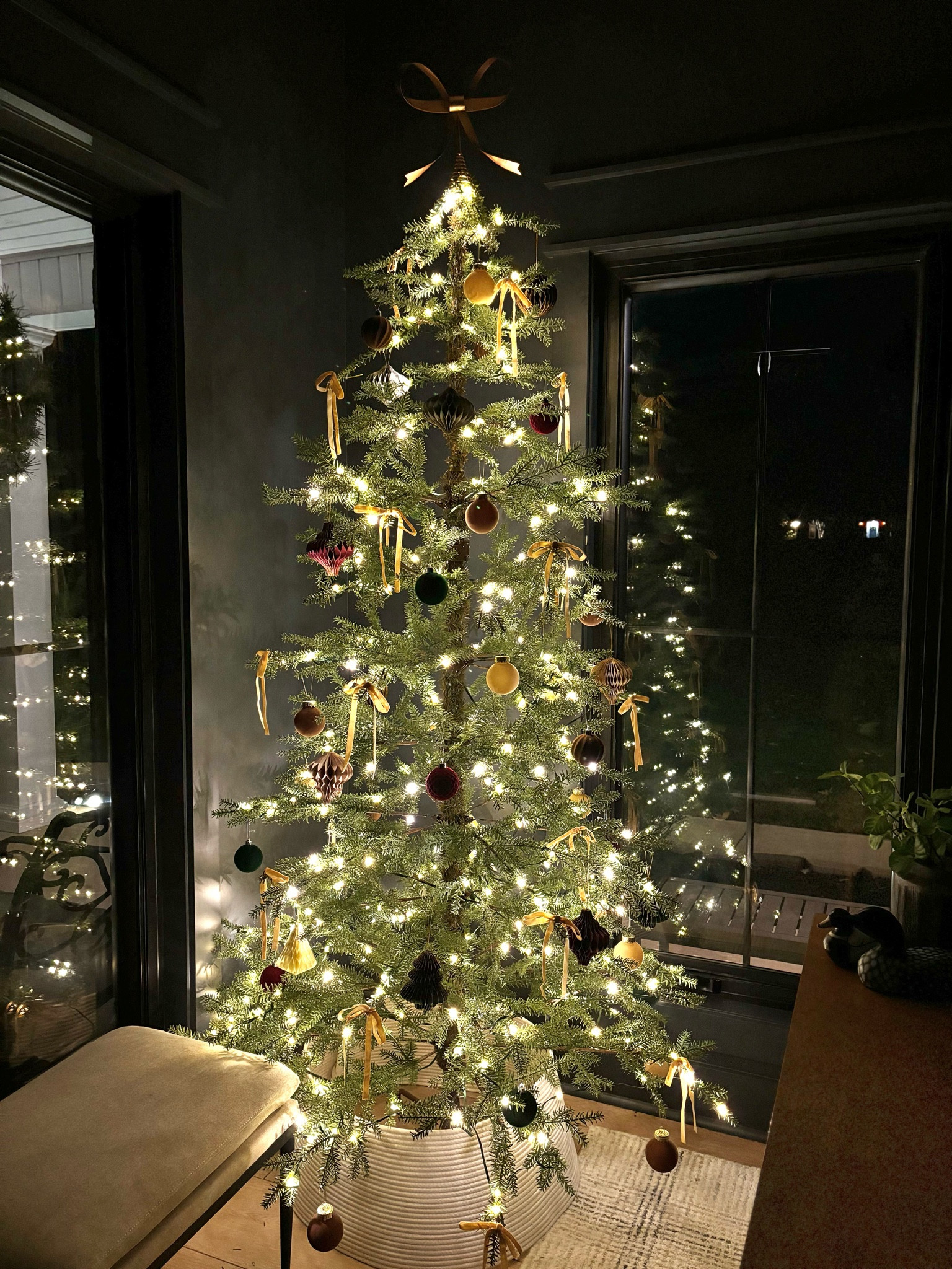 Hopefully I’ll get some time to decorate the rest of the house Sunday but until then- I think I have finalized my office Christmas tree (but don’t hold me to it!) almost everything on this tree is from Amazon, including the tree itself! I am loving the sparse tree look, the velvet bows, the paper ornaments, and the velvet baubles. The glow from the front porch window is beautiful and the warmth of the lights against the dark paint is perfection! You can comment “officetree” for a direct link- but make sure you’re following me first so my message doesnt get rejected 🤍 #christmas #christmastree #homeoffice #sparsetree #2024christmas #christmastrends #interiordesign #homelately 

#LTKHome #LTKHoliday #LTKSeasonal