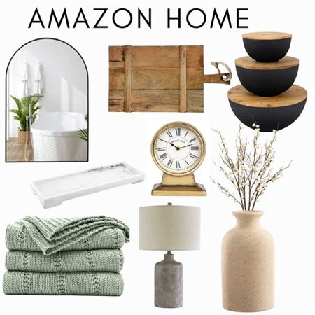 Amazon Home 
Arched mirror 
Wood board 
Black storage bowls 
White marble tray 
Throw 
Clock
Lamp 
Vase 
Faux flowers 

#LTKhome #LTKFind