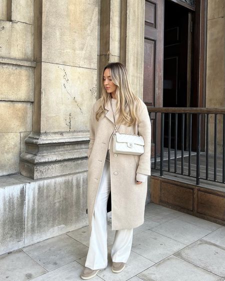 All cream neutral outfit perfect for winter. Cream long smart coat, white flared trousers, Loro piana shoes, cashmere jumper & white Chanel  

#LTKstyletip #LTKshoecrush #LTKitbag