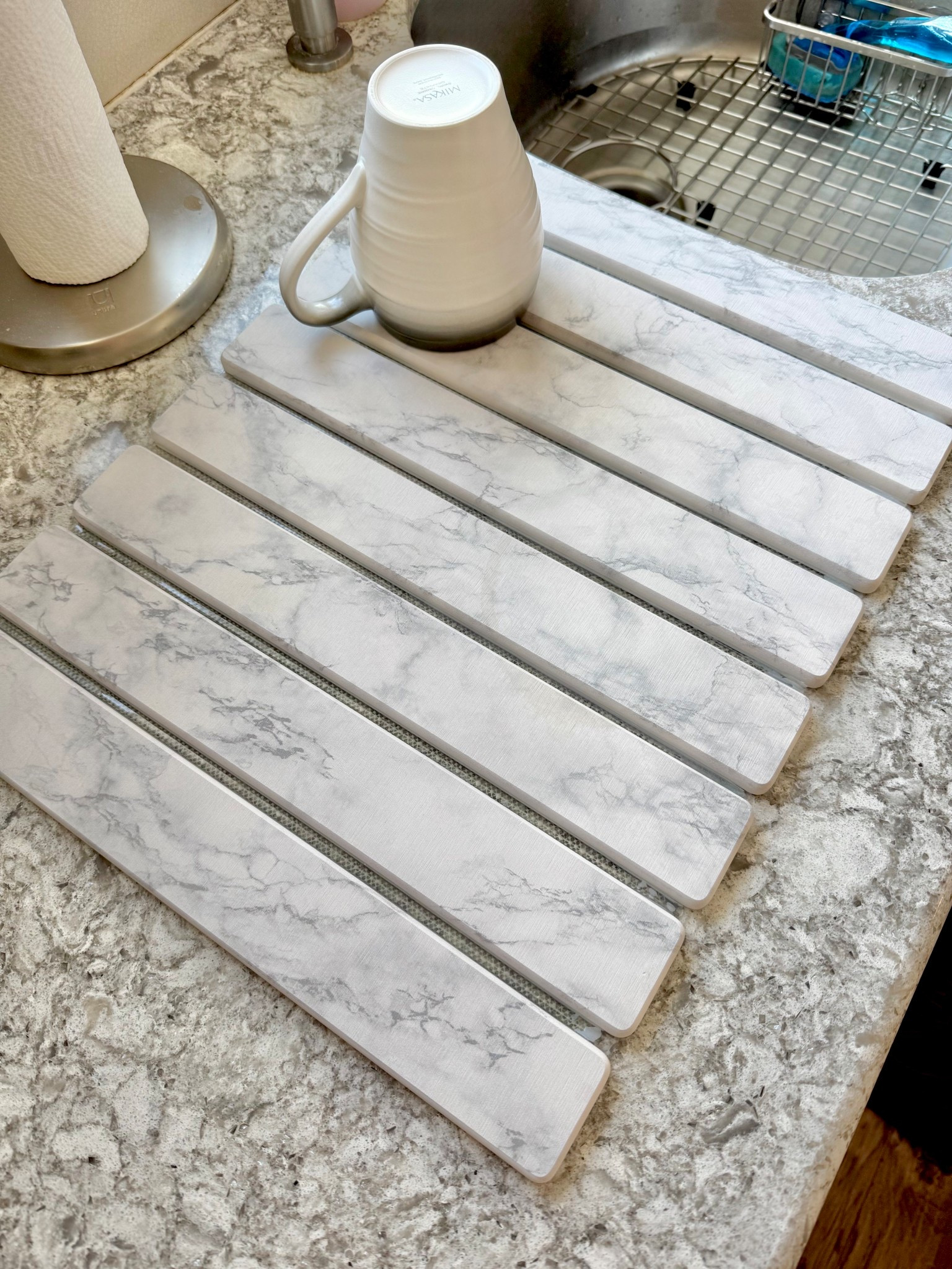 Just got this new dish drying mat made from diatomaceous earth. It absorbs water REALLY fast and looks so much nicer than a drying rack or towel. Plus you can roll it up for easy storage. 

Dish drying mat, diatomaceous earth drying mat, kitchen finds, Amazon kitchen finds, Amazon kitchen, white marble kitchen, white and gray kitchen, white and grey kitchen, Amazon home finds