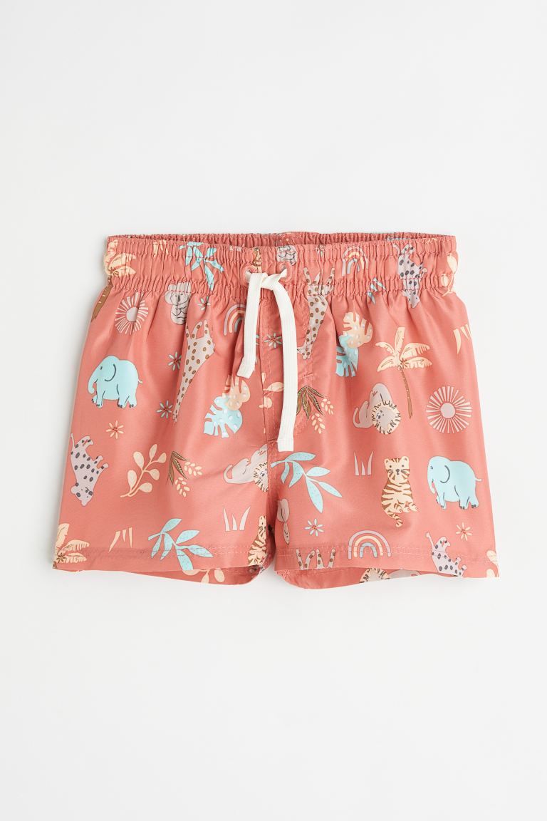 Swim shorts with a printed pattern. Elasticized waistband with drawstring and mock fly. Soft mesh... | H&M (US)