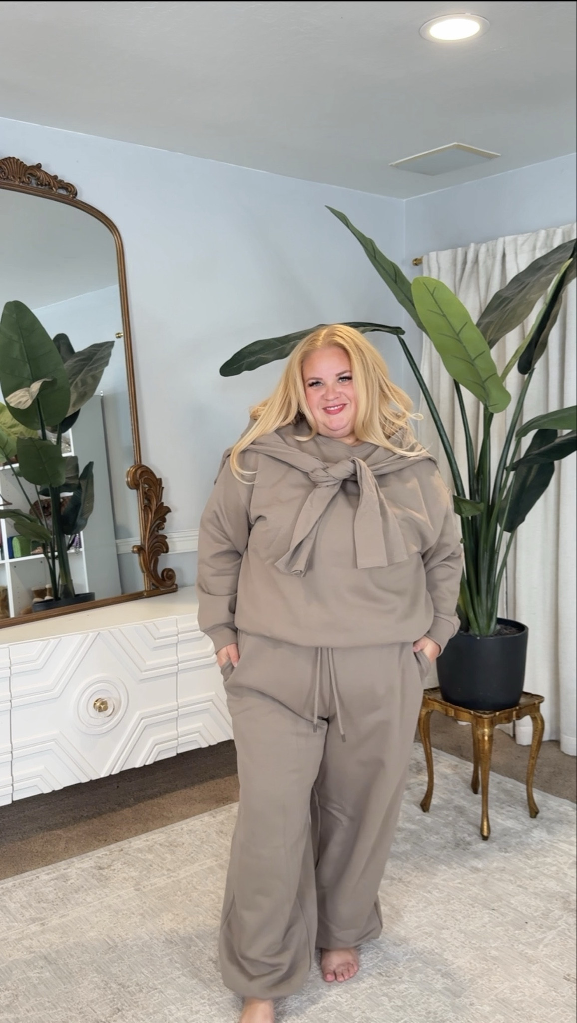 Neutral lounge but elevated 🤎

This set is soft, structured, and actually flattering instead of sloppy. The sweatshirt has a relaxed fit without swallowing your shape, and the wide leg pants drape instead of cling. The matching tone makes it look intentional, not like random sweats.

Perfect for travel days, errands, coffee runs, or working from home while still looking put together.

Linked in my LTK with sizing details.

#LTKPlusSize #LTKOver40 #LTKMidsize