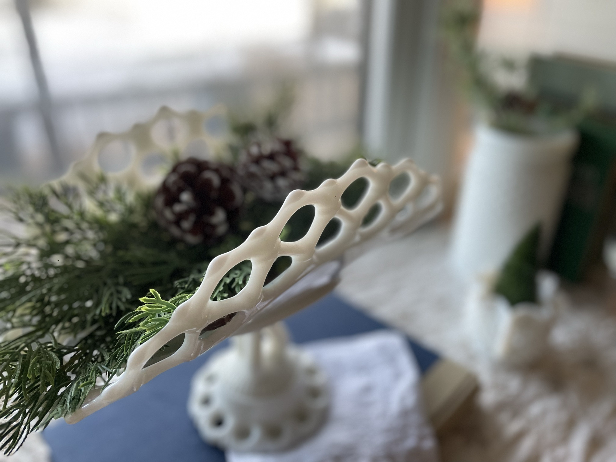 Vintage milk glass, especially banana stands, are the most lovely pieces of Winter decor!
They are versatile and simple, enabling you to create pretty vignettes all year long!

#LTKSeasonal #LTKhome #LTKfindsunder50