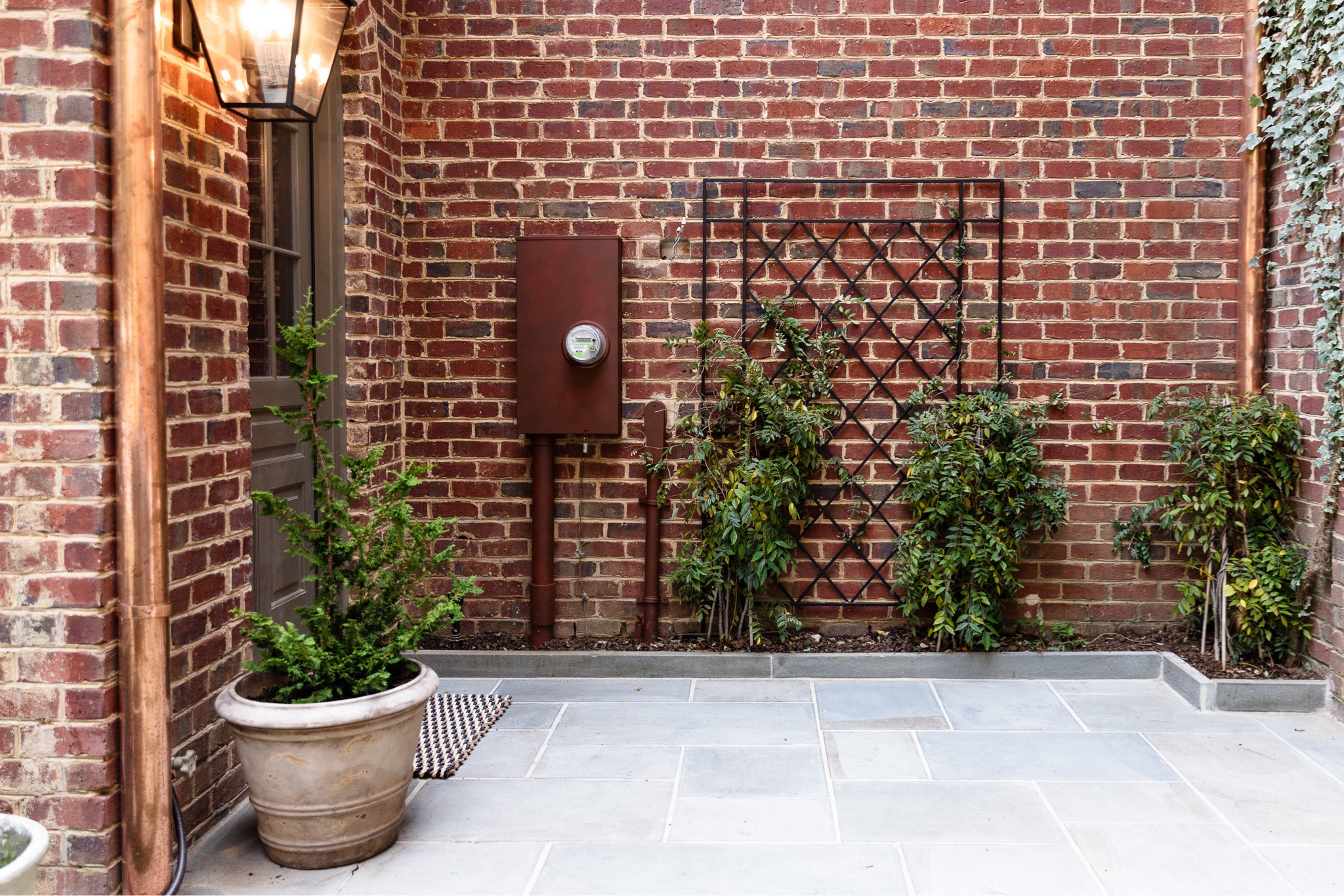 This little corner of our yard has undergone a complete transformation over the past few weeks. From big projects (like adding a door and a bluestone patio) to painting the electrical meter box, this space is now complete. I purchased the trellis and planter from my local nursery but linked a bunch of similar options for you below!

#LTKStyleTip #LTKHome #LTKU