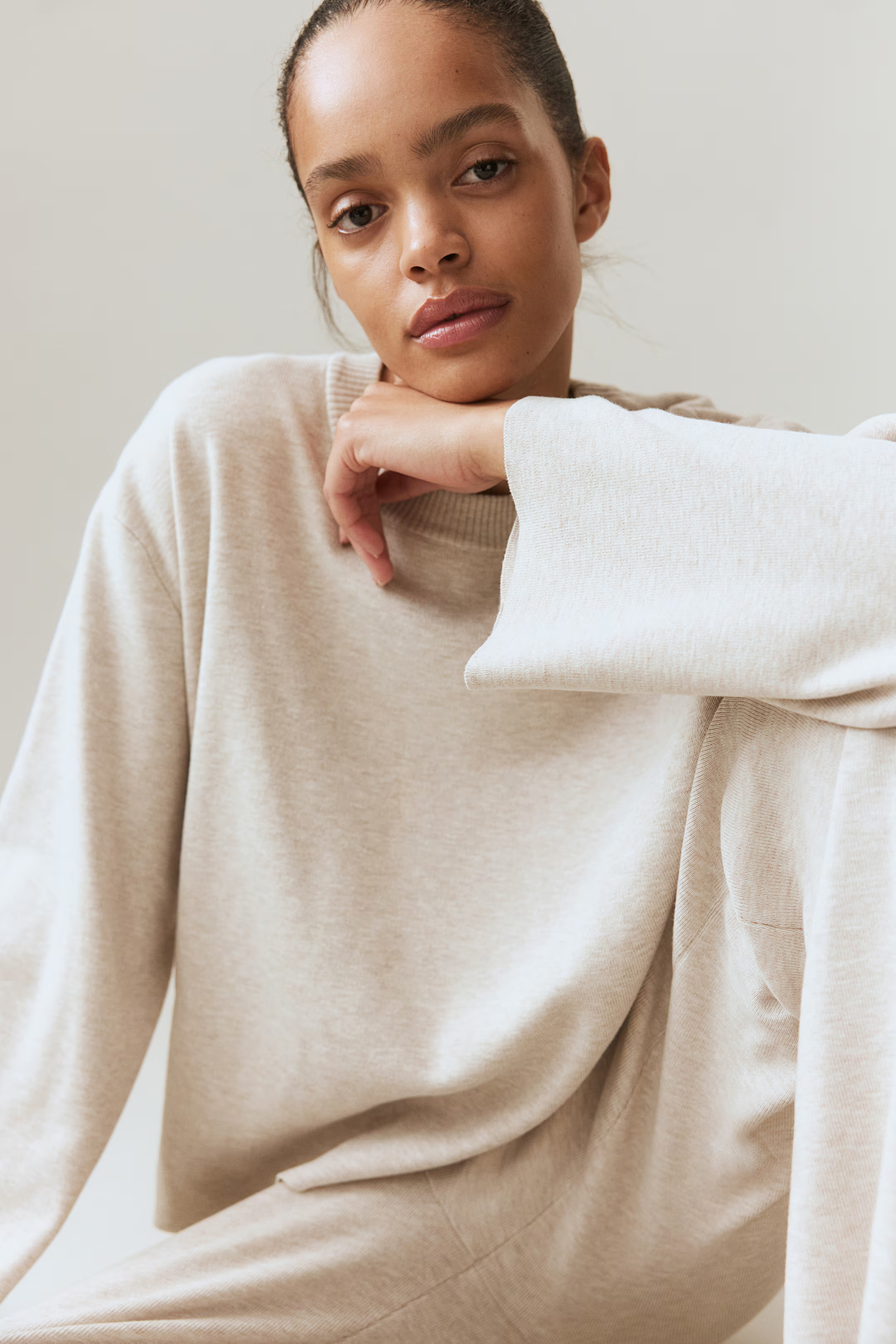 Oversized Pullover mit gerundetem Saum. - Hellbeigemeliert - Ladies | H&M DE | H&M (DE, AT, CH, NL, FI)