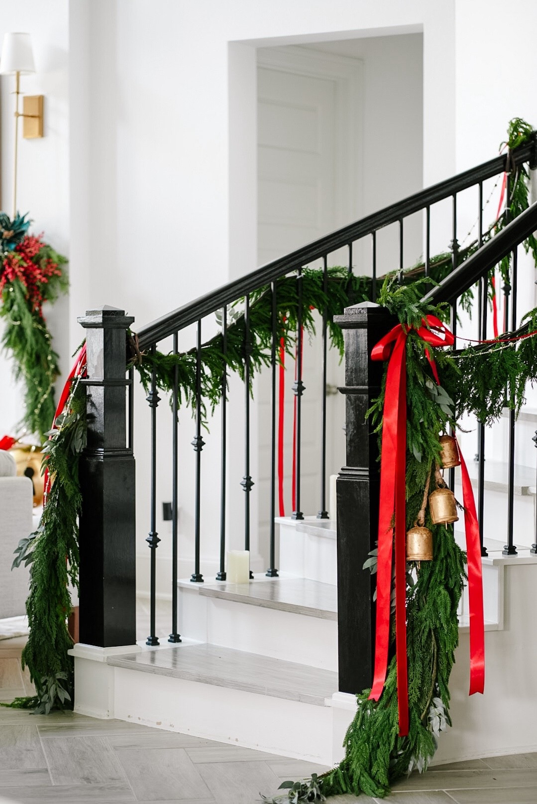 Holiday staircase styling ✨
Linked everything I used to get this classic Christmas look — layered garlands, bold red ribbons, and the prettiest gold bells for that timeless entryway moment. Tap to shop the exact pieces and recreate this cozy festive vibe in your home. 🎄🎀

#LTKSeasonal #LTKHome #LTKHoliday