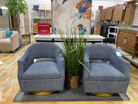 Swivel accent chair with navy fabric, open back detail, and wood swivel base. Add a pair with a cute accent table between  

#LTKOver40 #LTKHome #LTKStyleTip