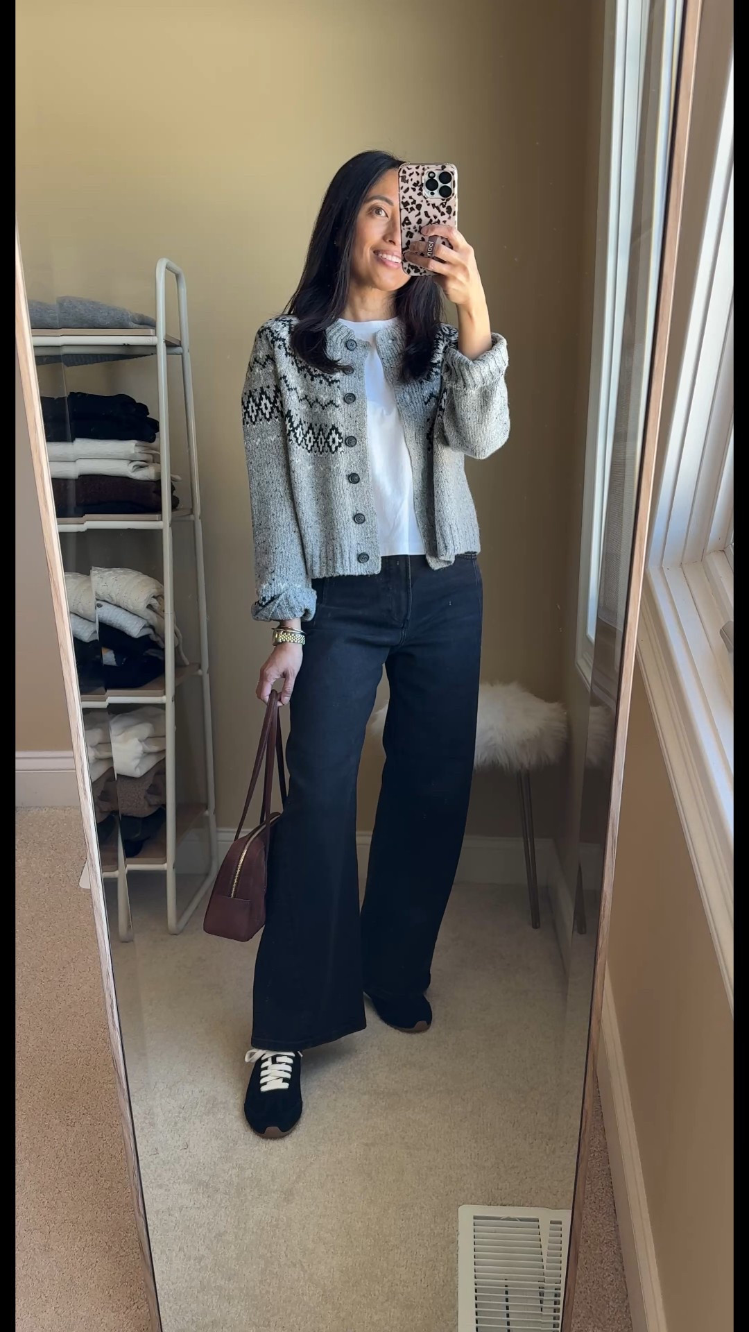 Winter outfit: classic sweater. 
-I decided that I needed to add a fair isle sweater to my wardrobe. Somehow all these winters growing up in the Midwest, I never had a sweater of this classic style. Exact sweater comes in and out of stock. True to size. I’ve linked other similar designs. 
-Black jeans are a new style to me. Love the cut that feels like a wide leg / slight barrel mix. I sized up, but could’ve also stayed true to size. Luxe denim material with stretch. 
-Black suede sneakers with a slim profile. 
-Good quality all-cotton t-shirt that makes a great base layer. True to size. 
-Suede bag is easy to carry on the shoulder or arm. 


#LTKHoliday #LTKOver40 #LTKootd