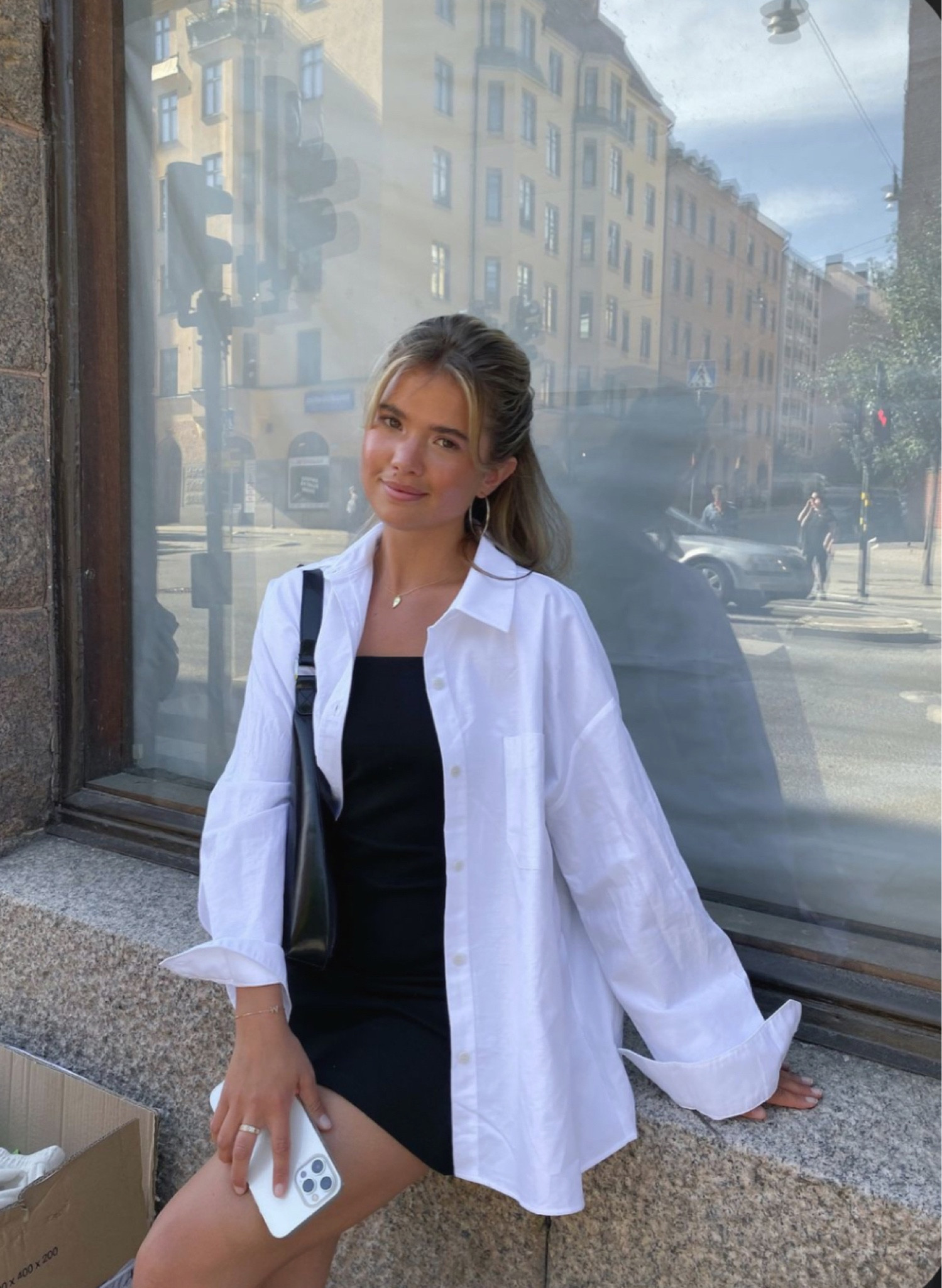 Black mini strapless dress with white oversized, button-down top, accessorized with black shoulder bag and thin hoops. Transitional wardrobe. Back to school clothes. Fall girl aesthetic. Summer fits. Winter outfits cold. Old money outfit. Outfit ideas. Fashion inspo outfits. Modest outfit inspo. First date of school outfits. Dress to impress. Fall outfits. Discover style ideas. School outfits. Work outfits. Travel outfit. Jeans outfit. Gameday outfit. Europe outfit. Night out outfit. Streetwear fashion. Easy office outfits. Beach outfit

#LTKstyletip #LTKtravel #LTKfindsunder100