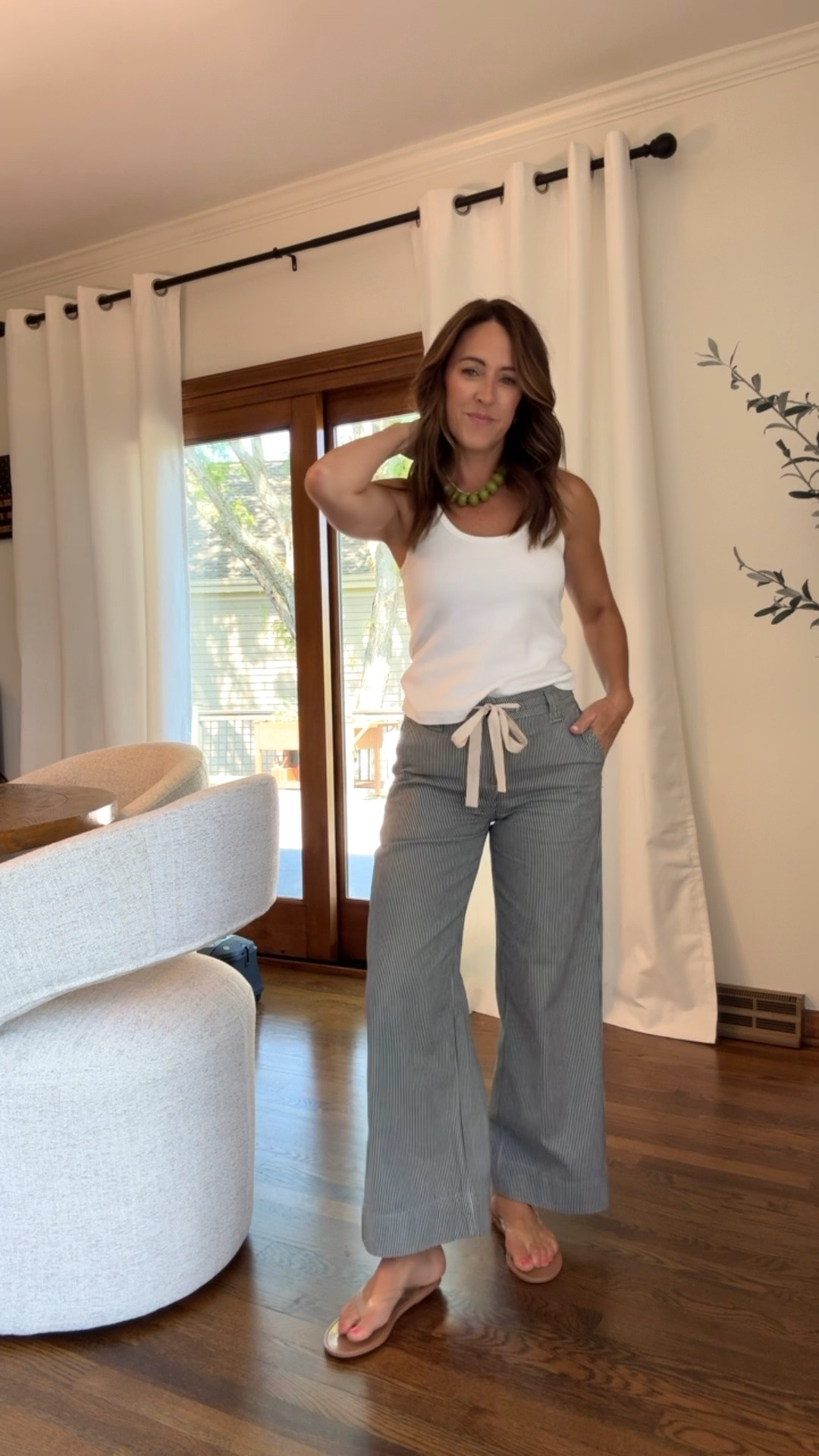 Navy and white stripe wide leg pants. 
20% off code: twopeas20
True size 25 here. If between or would like a slightly loose fit, size up. I’m 5’3”
XS tank

#LTKmomlife #LTKMothersDay #LTKootd