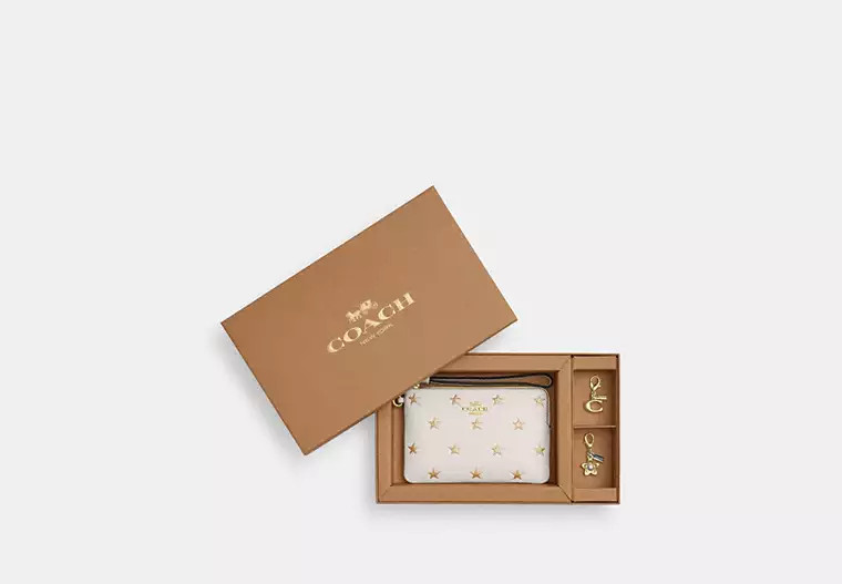 Boxed Corner Zip Wristlet With Star Print And Charms | Coach Outlet CA