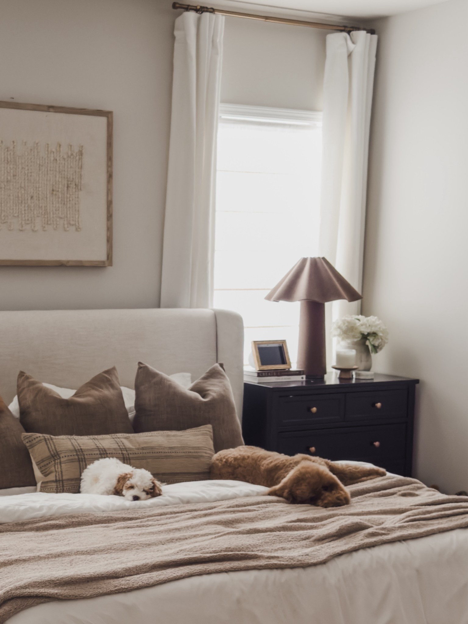 Bedroom refresh while staying true to my neutral style — just a bit more bold. I’m leaning into deeper brown tones, rich textures, and quality pieces that add warmth and depth while still feeling light and calm.

One of my favorite details is the nightstands — technically baby dressers. They blend in seamlessly but add so much extra storage, which is always a win. Cozy, layered, and designed to actually be lived in (dogs included).

#LTKHome #LTKSaleAlert