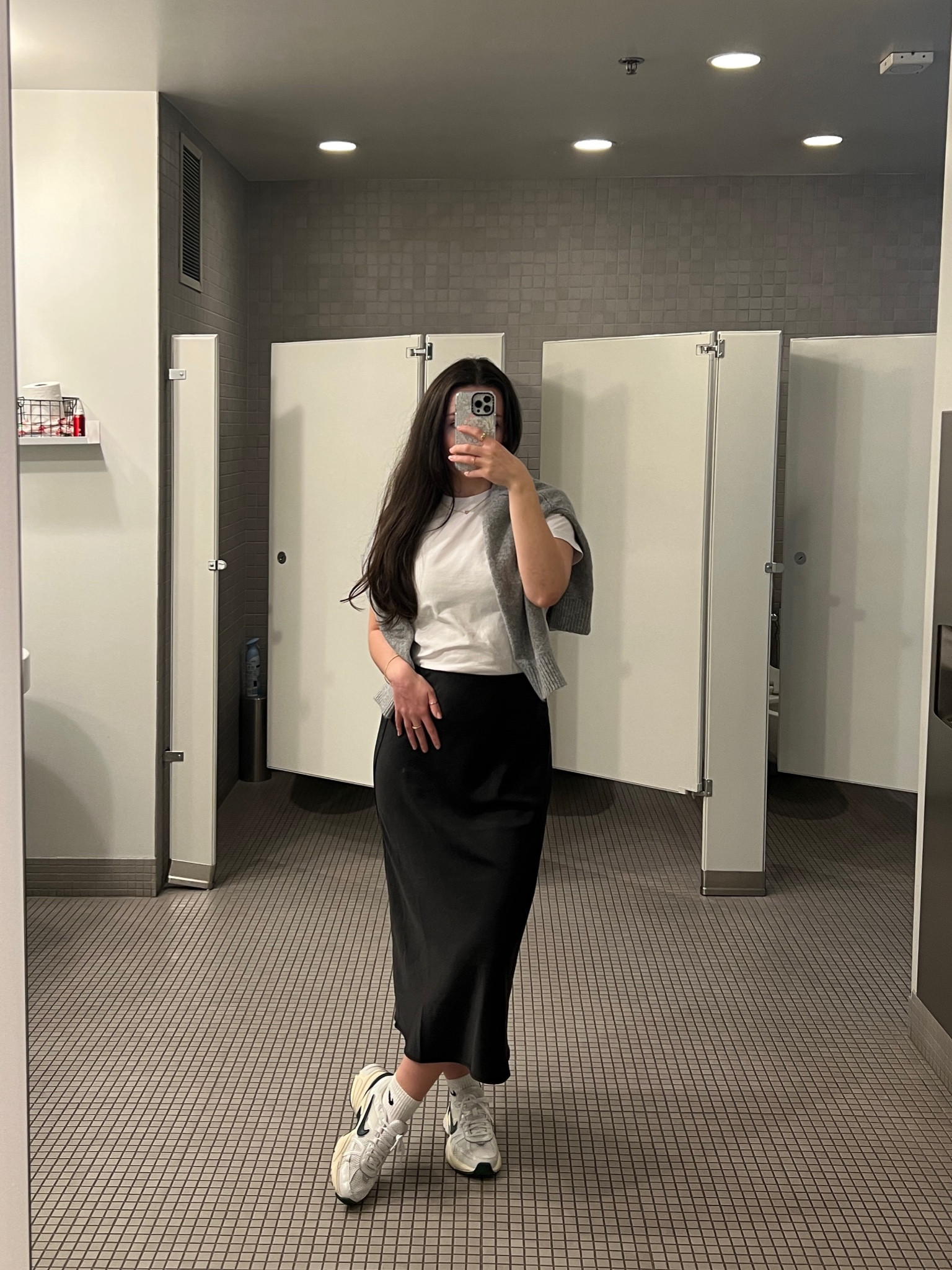 Simple work ootd
Grey sweater, white t-shirt, black midi satin skirt, Nike everyday sneakers, capsule wardrobe, closet basics

#LTKworkwear #LTKSeasonal #LTKSpringSale