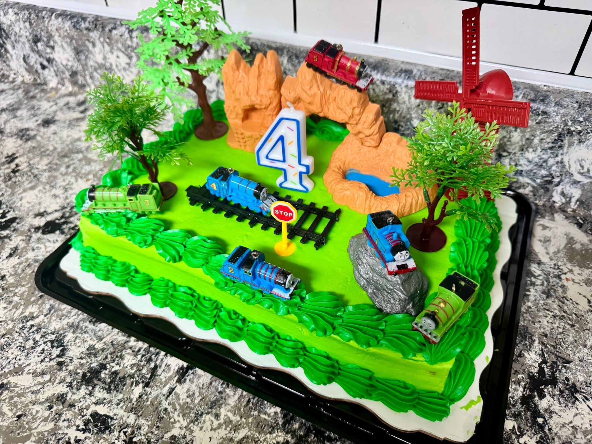 Thomas the Tank Engine cake toppers. Not the exact one linked, but similar! 

#LTKParties #LTKKids