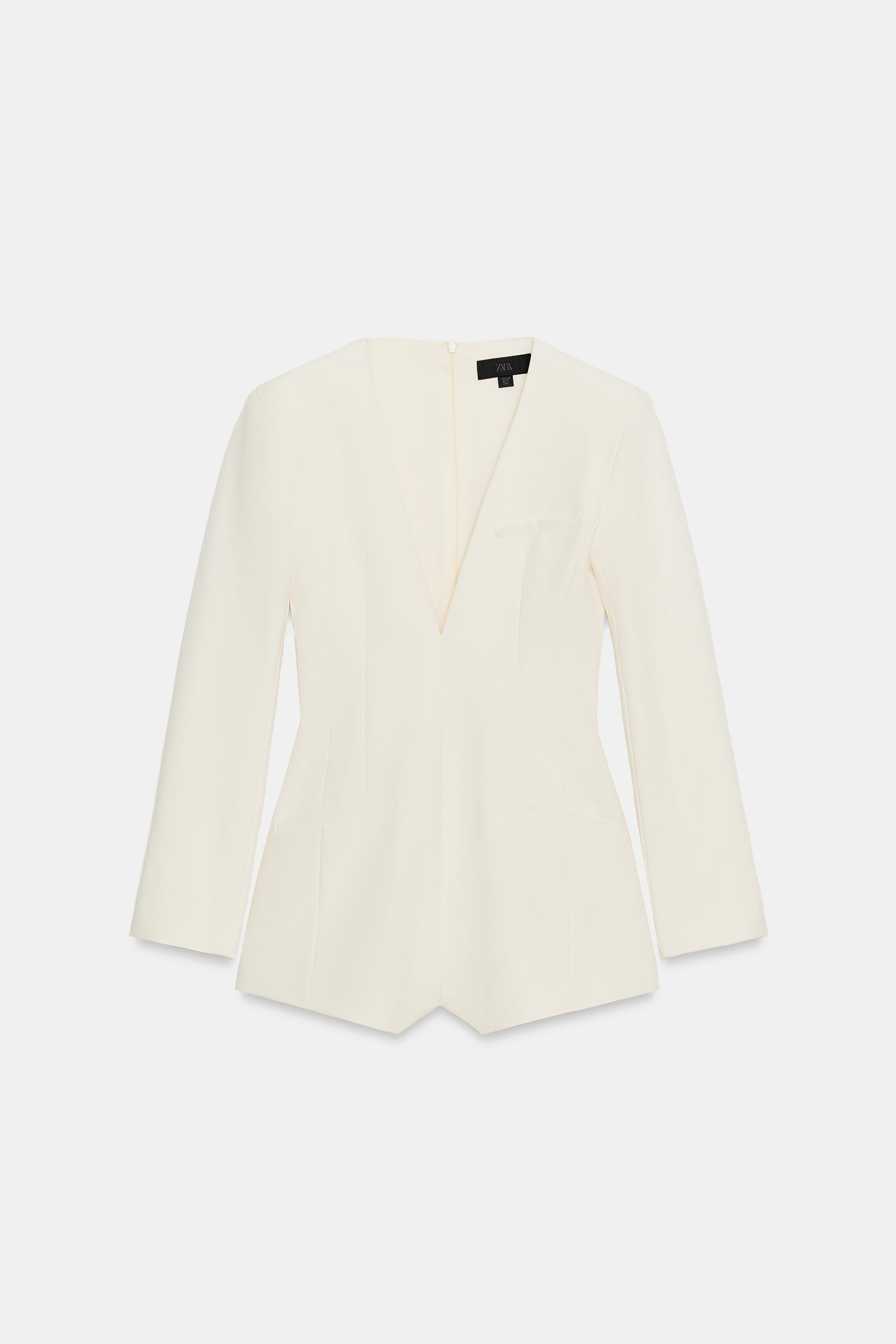Model height: 176 cmV-neck playsuit with long sleeves and shoulder pads. Featuring faux welt pock... | Zara UK