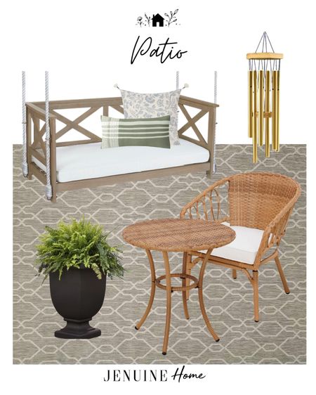 Patio. Traditional patio. White and blue floral throw pillow. Outdoor throw pillow. Lumbar throw pillow Green outdoor. Cafe table and chair. Patio breakfast table. Porch swing. Farmhouse porch swing. Outdoor black planter pot. Gold wind chimes. Neutral grey outdoor rug. Neutral gray outdoor rug  
