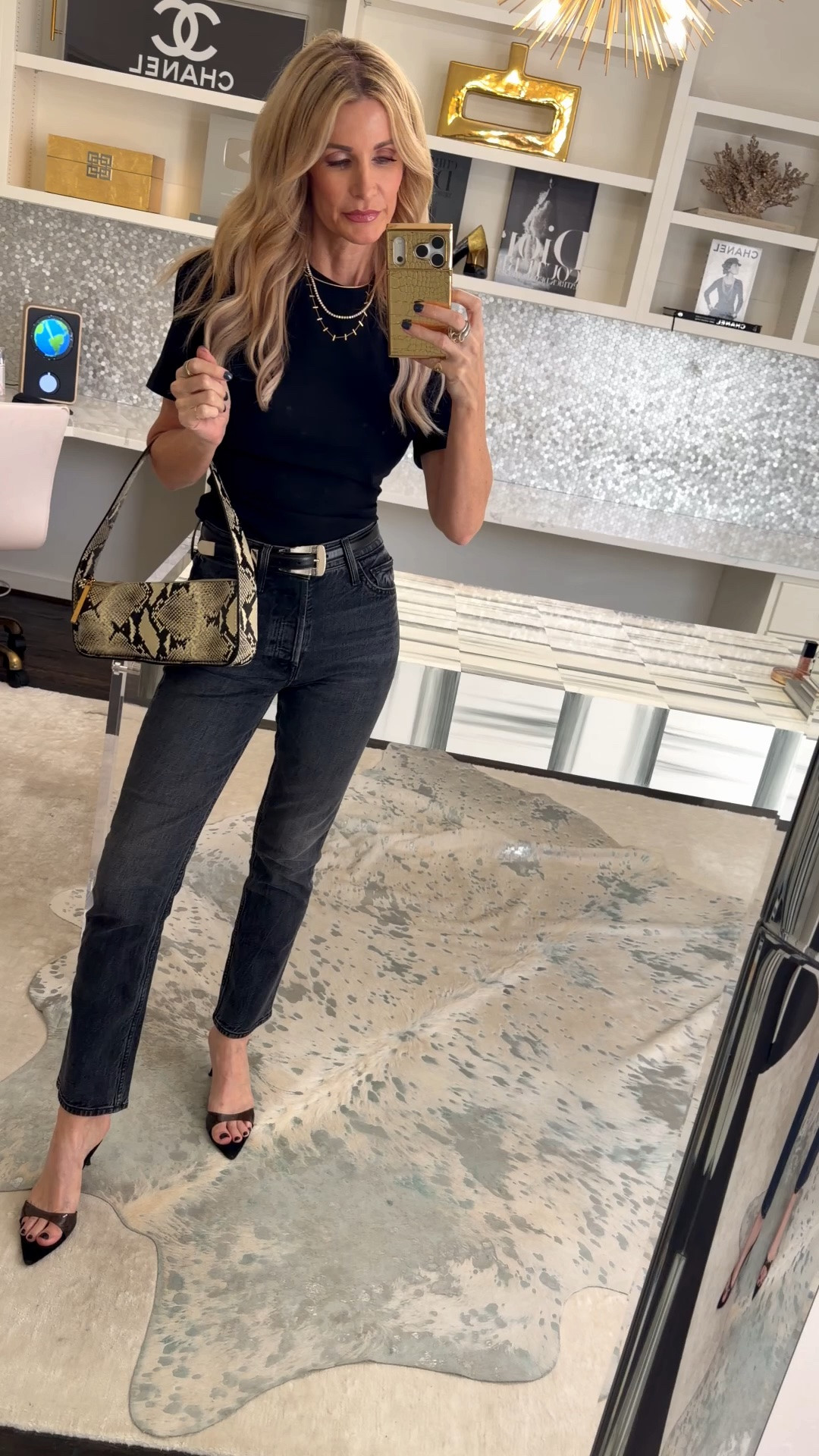 A classic black tee and jeans outfit that feels effortlessly chic 🖤 The pointed-toe heels, layered necklaces, and snake-print bag give these everyday basics a polished finish. I’m wearing an XS in the tee and a 24 in the denim. #LTKOver40 #LTKStyleTip #LTKootd
 

 #LTKootd #LTKSeasonal #LTKOver40