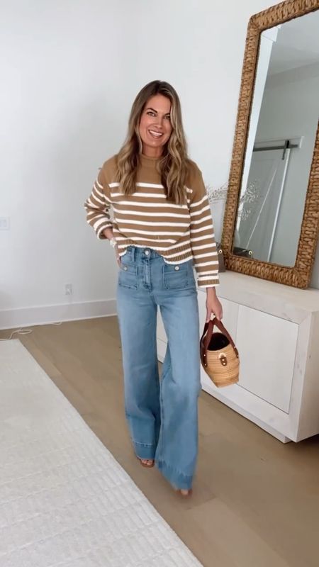 Wide leg trouser jeans! Size down if between - they stretch a bit with wear. I am 5’11” wearing my usual size (26 long) and pair them with a heel.  Small striped sweater. Xs tee. Sandals true to size.  

#LTKstyletip #LTKover40 #LTKVideo