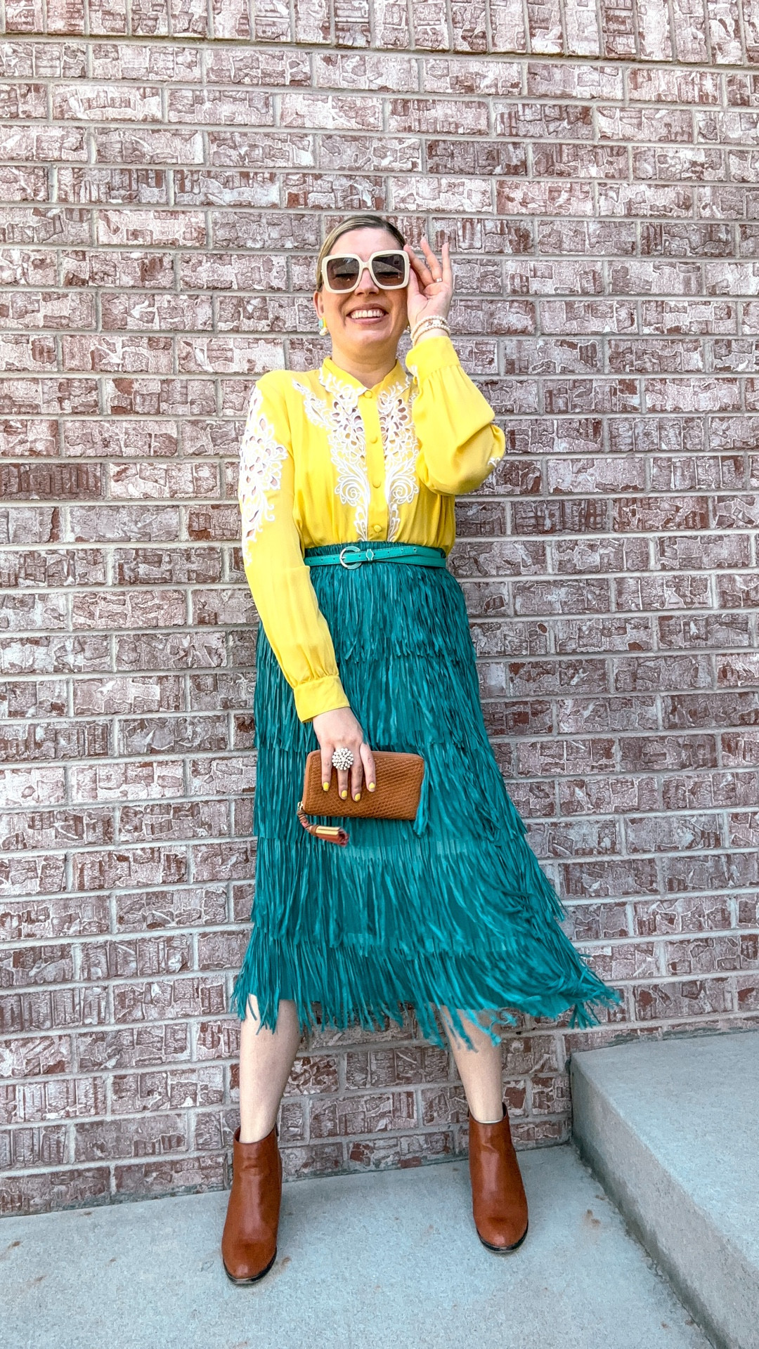 Look 4 - Desert Dust 🌵 
A curated style series

This one’s an outfit repeat -and one of your favorites from last year - so of course I had to bring it back! The top is a thrifted vintage Bob Mackie (such a fun find!), and I’ve linked a couple available online. It also came in other colors and there are still some floating around online. The skirt is actually from Amazon. I rarely shop there, but I had a gift card and couldn’t find a fringe skirt in this color anywhere else. Now there are more options out there, so I’ll link a few, but this one’s a super fun + affordable way to dip a toe into fringe. It’s really comfy too!

My Desert Dust capsule is all about reimagining Western heritage through my lens - playful, colorful, and preppy! It draws inspiration from vintage Western classics and my own family history in the West. Each capsule I create is a curated mini-collection of outfits built around a theme.  

Top - Bob Mackie (linked)
Skirt - Amazon (linked)
Earrings - Lele Sadoughi 
Wallet - Tory Burch
Boots - Bamboo
Sunglasses - Francesca’s
Belt - Dillardss
Ring - Stella & Dot (similar linked)
Braclets - Target/Rocksbox (similar linked)

#DesertDustCapsule #VintageWestern #BobMackie #WesternInspired #CapsuleWardrobe #WesternChic

#LTKSeasonal #LTKFindsUnder50 #LTKTall