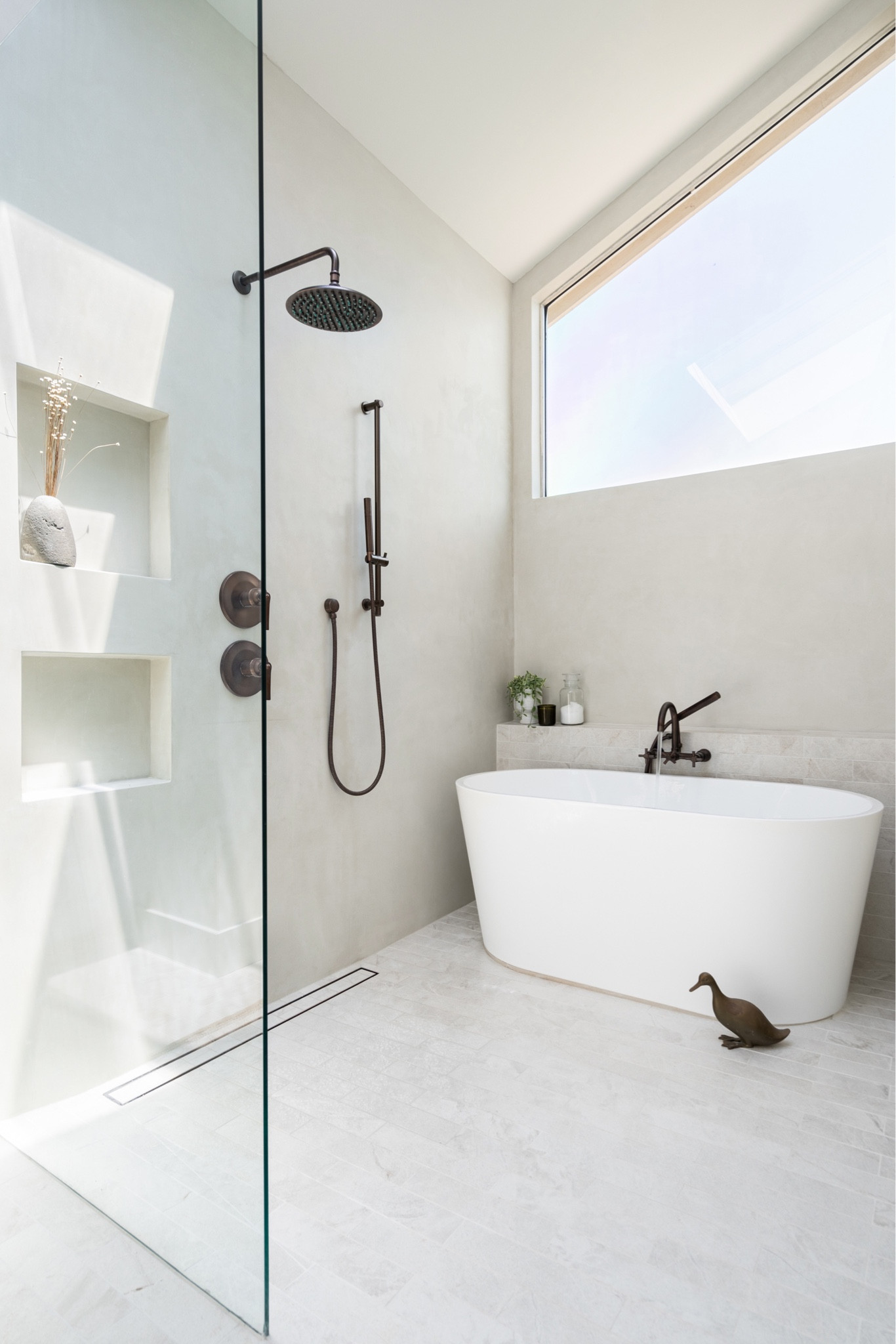 Earthy design for a neutral, textured bathroom.  

Oil-rubbed bronze faucet, soaking tub, rug, pendant light, plush towels, wooden floor mirror, wood ladder, frameless round mirror, flitted side table, 

Bathroom decor, bathroom finds, home decor, interior design. 

#LTKhome #LTKFind #LTKstyletip
