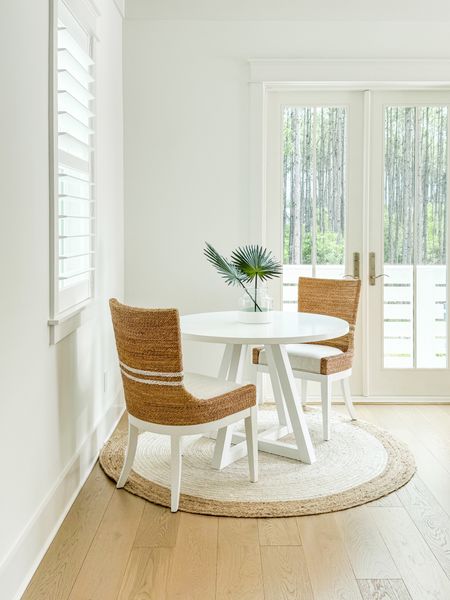 Our new striped seagrass dining chairs in our Florida carriage house dining area! I love this round white dining table (a budget find!) paired with these chic dining chairs. Also linking our round jute rug, colorblock vase and faux tan palm stems. You can take the full carriage house tour here: https://lifeonvirginiastreet.com/our-florida-carriage-house-tour/.
.
#ltkhome #ltksalealert #ltkstyletip #ltkseasonal #ltkfindsunder50 #ltkfindsunder100 #ltktravel small dining area ideas, round rug

#LTKSeasonal #LTKSaleAlert #LTKHome