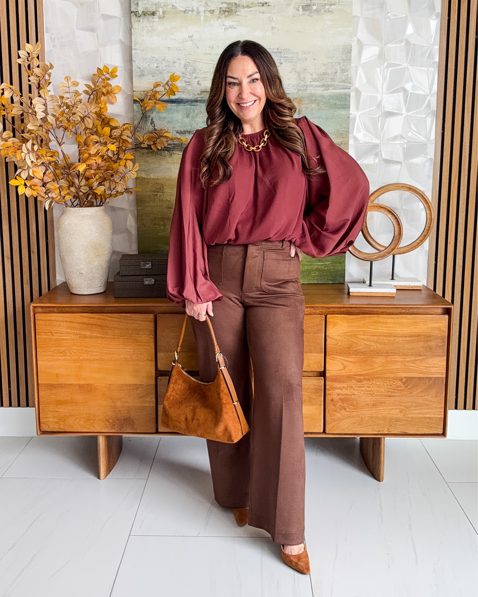 A pretty burgundy blouse + chocolate brown pants is such a good fall color combination. Easy to dress up for work or dinner.  Wearing faux Suede Pants, tts, 31 | Blouse, L

#LTKSeasonal #LTKOver40 #LTKMidsize