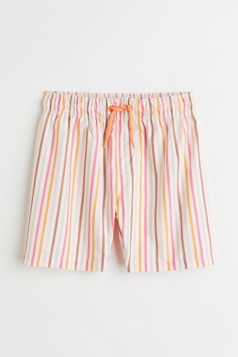 Patterned swim shorts with elasticized drawstring waistband and mock fly. Soft, mesh liner shorts... | H&M (US + CA)