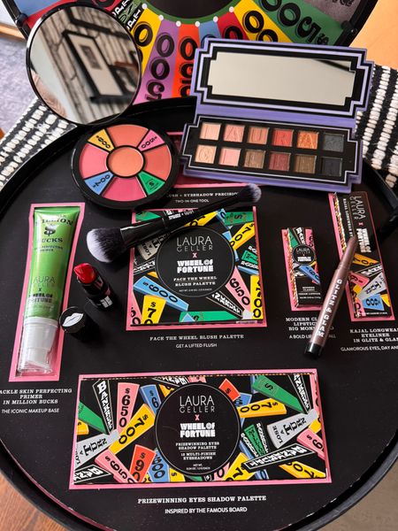 Laura Geller Beauty Wheel of Fortune collaboration collection. Would make a great #holidaygift

💲Spackle Skin Perfecting Primer in Million Bucks
💲Face the Wheel Blush Palette 
💲Modern Classic Lipstick in Big Red Money
💲Kajal Longwesr Eyeliner in Glitz $ Glam
💲Dual Ended Blush + Eyeshadow Precision Brush
💲Prizewinning Eyes Shadow Palette

#wheeloffortune #lauragellerbeauty 

#LTKbeauty #LTKHoliday #LTKGiftGuide