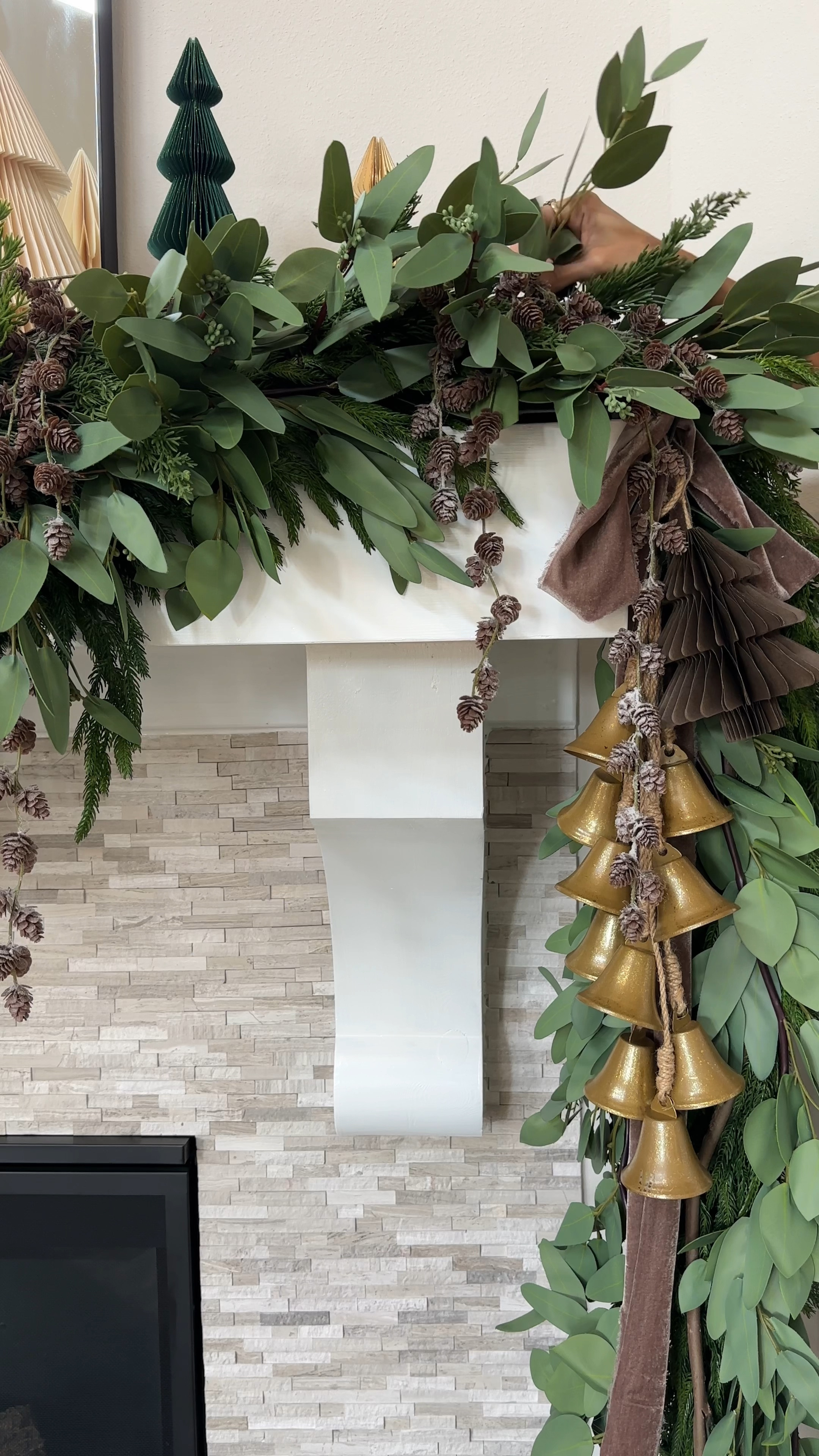 My holiday Mantel this year!! I used a mix of Norfolk pine garland, real touch eucalyptus, and my go-to eucalyptus stems to create depth and texture. Added a few light brown pine cone branches and finished it off with my favorite honeycomb trees. Cozy, earthy, and holiday-ready! #holidaymantel #stylingtips 

I used:
2 - 180” Norfolk pine garland 
2 - 60” Norfolk pine garland
3 - real touch eucalyptus garland in 5.5 ft
A handful of bunches of my tried and true eucalyptus stems 
4 - Hanging Light Brown Pine Cone Branch

And I added my honeycomb trees and done! 

#LTKVideo #LTKHoliday #LTKHome