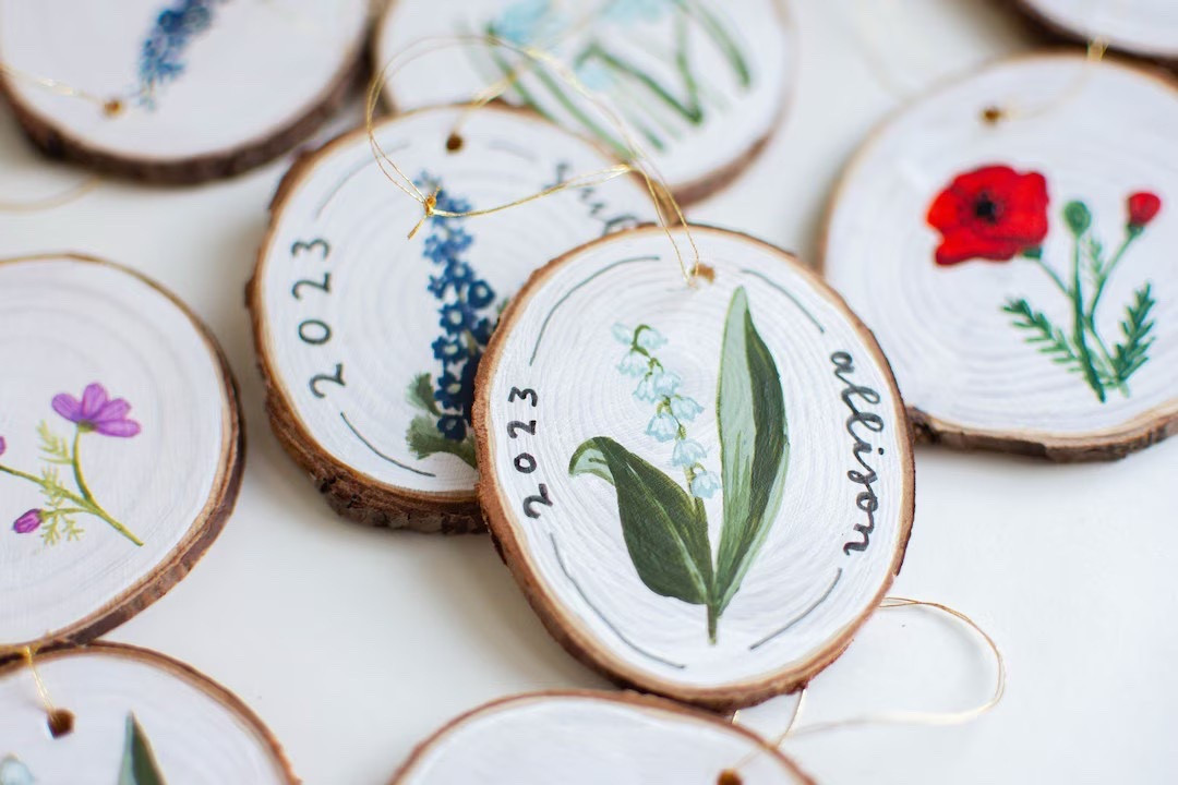 Add a personal touch to your holiday decorating with these beautifully hand-painted birth flower ornaments by TheColorBoxStudio. Each natural wood slice features a unique, hand-rendered bloom representing a specific birth month, making it a thoughtful gift for family, friends, or anyone who loves meaningful décor. With room on the back to add your own note and free shipping on qualifying orders, these customizable pieces are the perfect blend of artistry and sentiment. #EtsyFinds #BirthFlowerGift #HandPaintedOrnament #HolidayDecor #PersonalizedGifts #LTKHoliday

#LTKHome #LTKGiftGuide #LTKHoliday
