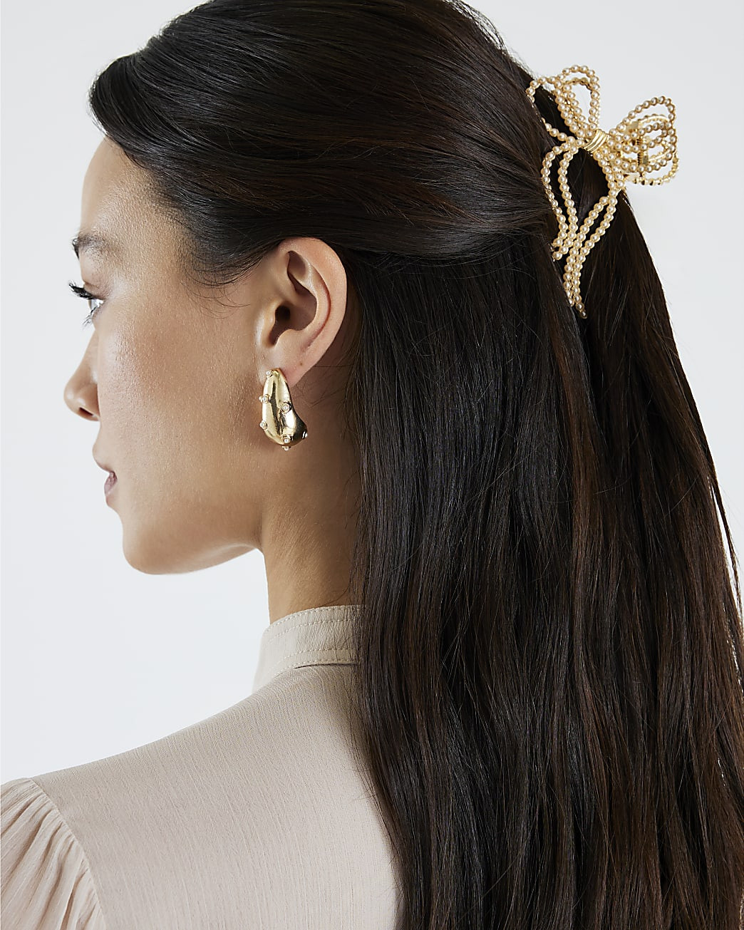 Gold Pearl Bow Claw Hair Clip | River Island UK & IE
