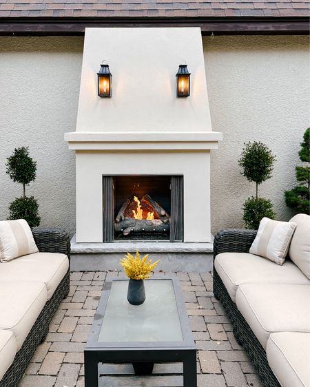 We love our blackened copper lanterns/sconces on the outdoor fireplace in our patio. Linking some other beautiful & classic outdoor sconce options that we considered. #springdecor #curbappeal 

#LTKHome #LTKStyleTip