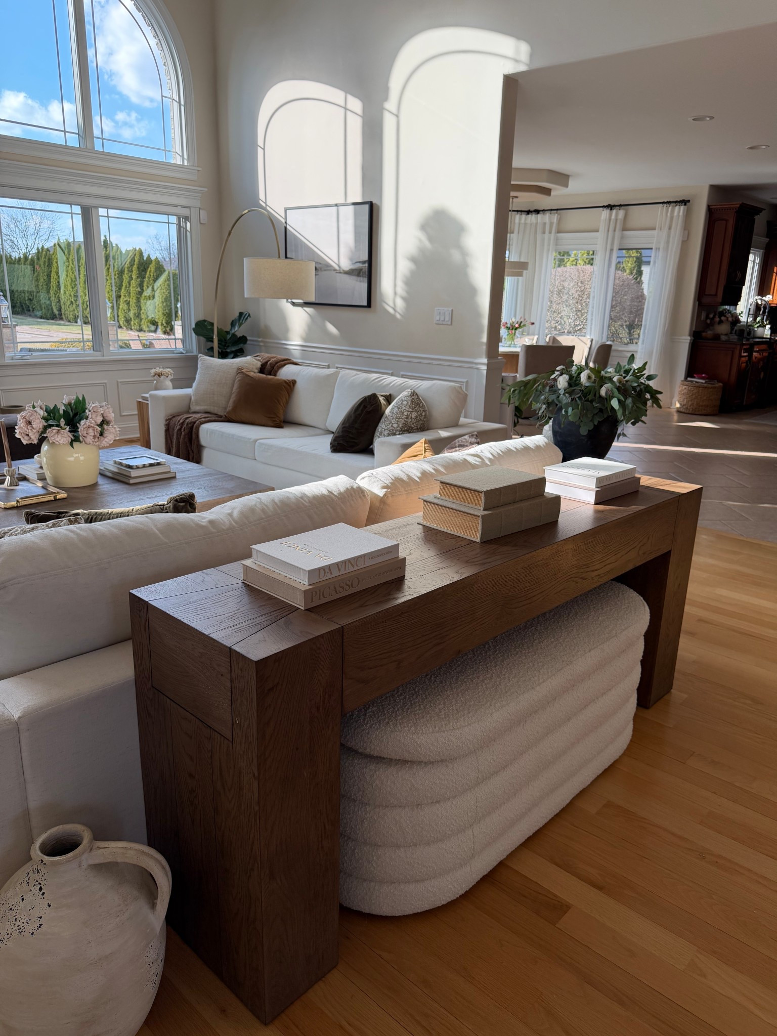 This console table moment might be my favorite styling detail in the room.
Books, simple decor, and a boucle ottoman tucked underneath keep it functional but beautiful. Sharing the console, ottoman, and styling pieces here.

#LTKHome