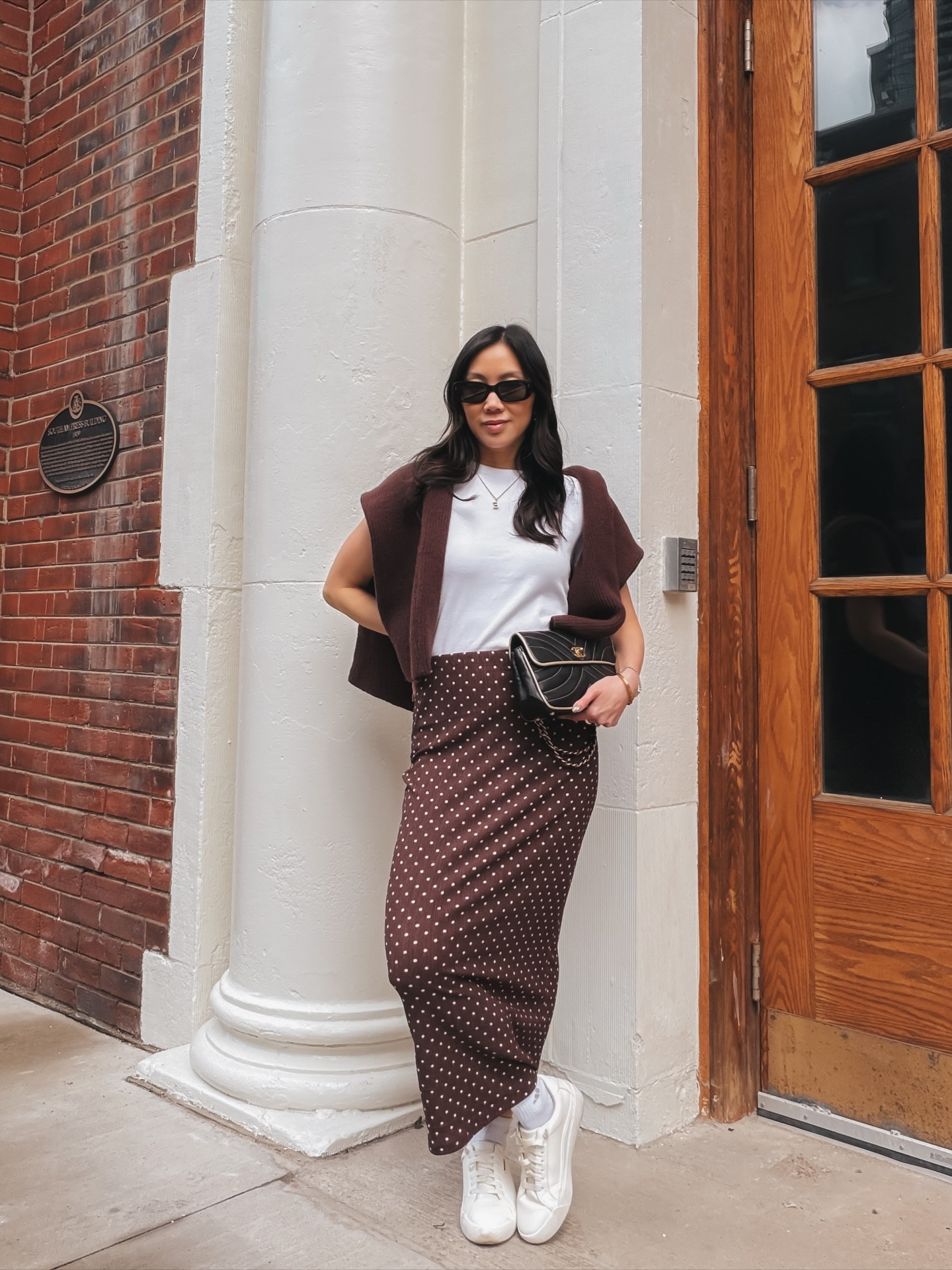 Trendy without trying, classic without feeling boring 🤎 polkadots have me obsessed! 

The sneaker + maxi skirt combo is the most underrated spring outfit formula and I will die on this hill 🍒

Comfortable enough to actually walk in, chic enough that nobody needs to know you prioritized comfy. 

Chocolate polka dot midi skirt + white tee + brown sweater + white sneakers — this is quite luxury on a real Tuesday. 

Honestly one of my favourite capsule wardrobe combinations because every single piece works ten other ways. 

Shop the full look on LTK — link in bio 🤍

Comment SHOP below to receive a DM with the link to this post on my LTK ⬇ https://liketk.it/69TIL #ltkootd 

Outfit details:
Best white tee: @aritzia  homestretch
Brown sweater: @commense.official 
Polka dot skirt: @ardene
Vintage Chanel bag: @joinzerocollective 
Jewelry: @deandavidson 
White sneakers: @drscholls_official