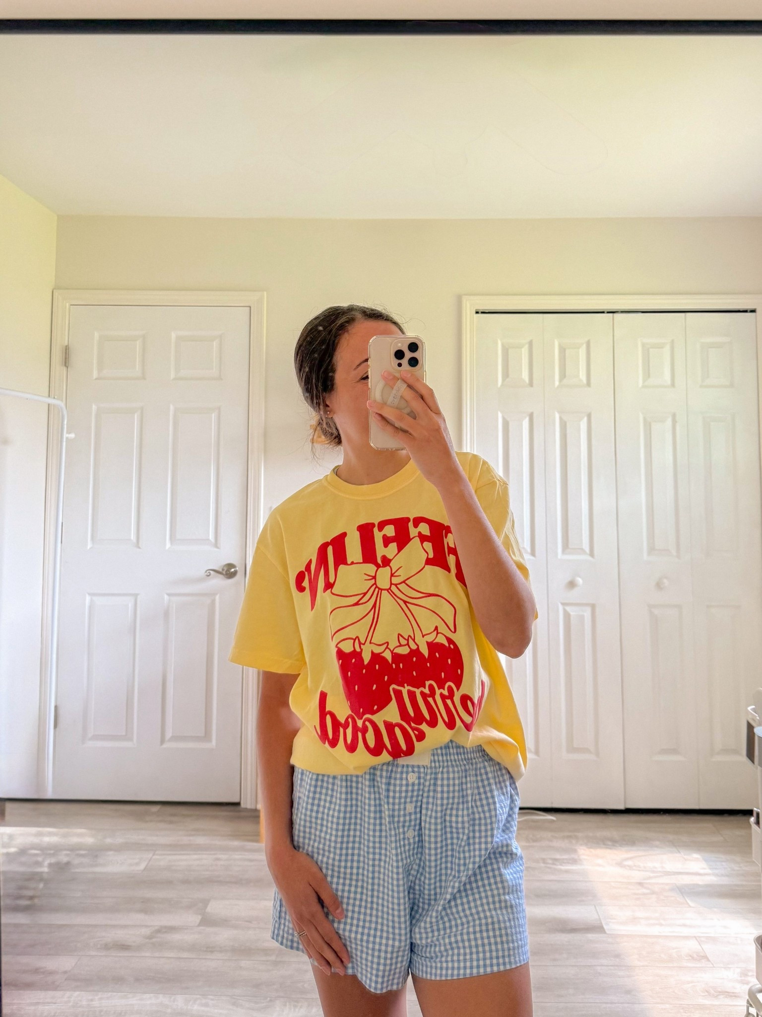 colorful casual summer outfit; oversized graphic tee, blue gingham boxer shorts

#LTKSummerEdit