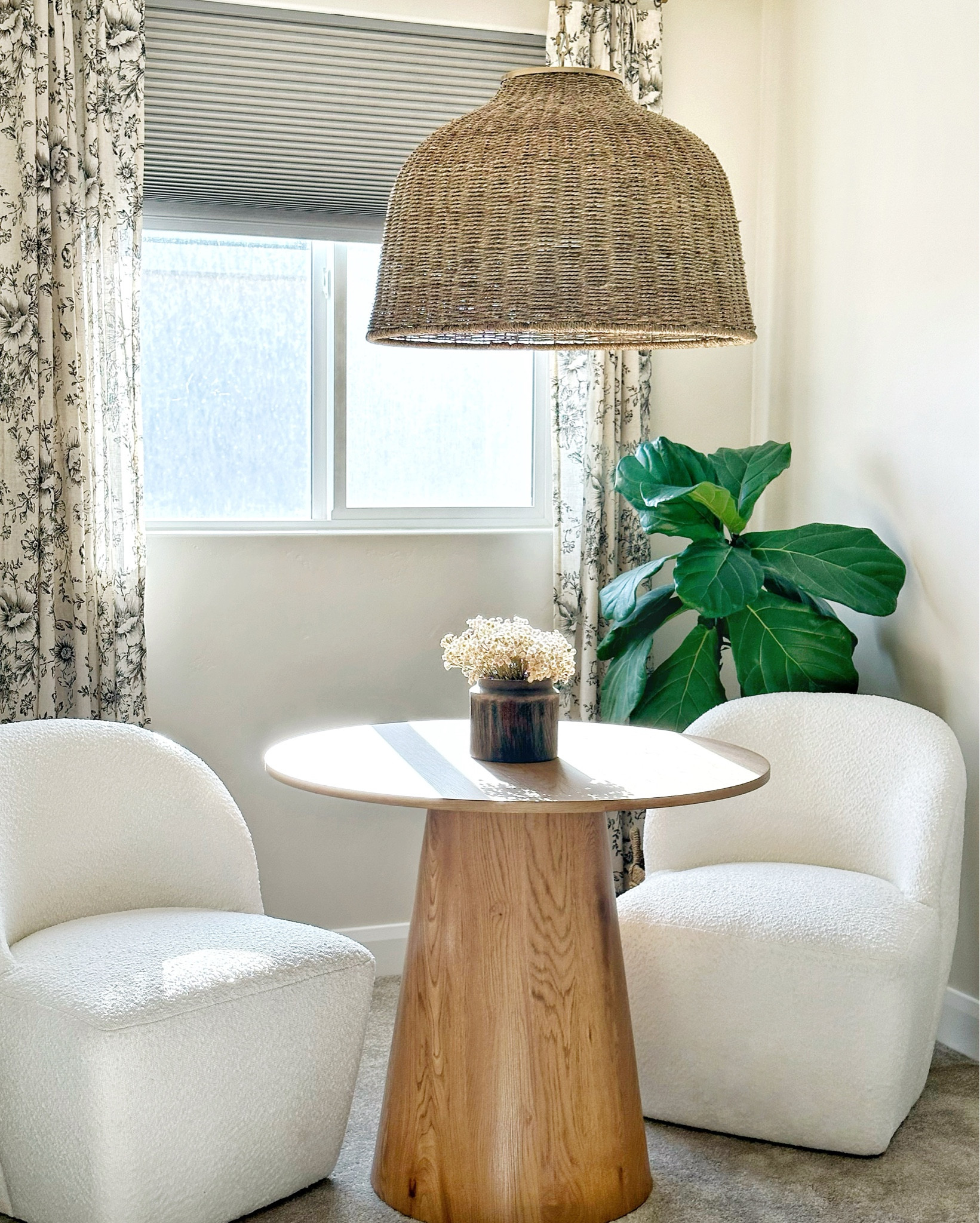 I love how this space turned out. What do you think, did I nail the design from my design board? 

Furnishing and designing this cute little nook tucked inside a dorm window, alcove area. Hurry and shop this look while some items are currently marked down. 

This inviting corner features two white armchairs flanking a round wooden table. The woven pendant light adds warmth, and the floral-patterned curtain completes the look. The perfect place for reading, playing games, or working from home. How would you use this cozy 

#LTKxNSale #LTKHome #LTKSaleAlert
