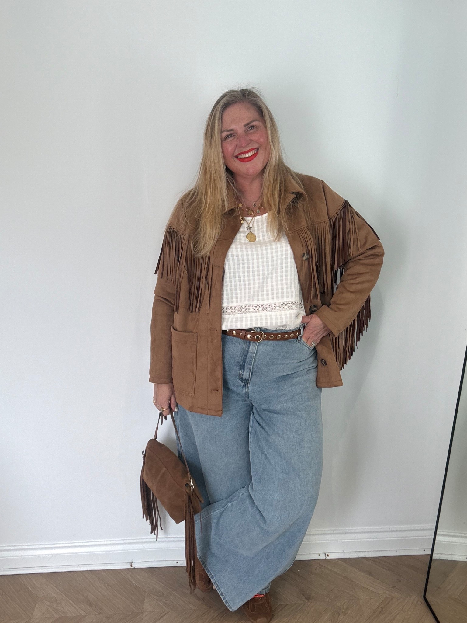 Tan suede tassel jacket, tan suede tassel bag, tan suede trainers, white blouse, palazzo jeans, brown belt

#LTKplussize #LTKspring #LTKjeans
