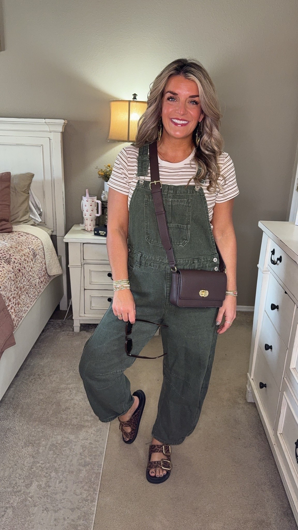 Today’s casual outfit: relaxed-fit overalls, neutral striped top, crossbody bag, and leopard sandals. Perfect for errands, weekend plans, or an easy fall look. All items linked for quick shopping — staples you’ll reach for again and again.
