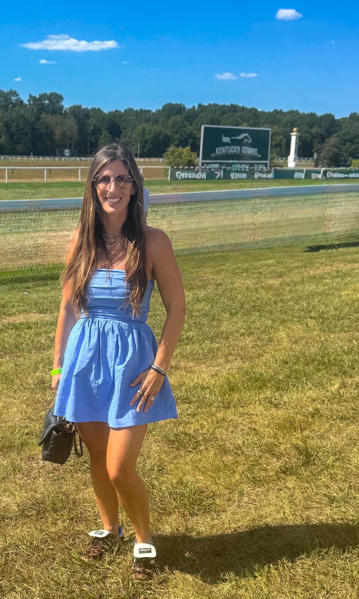 An unforgettable day at Kentucky Downs.  Our family explored the venue, cheered on the races, enjoyed the concessions, and best of all—we left on an absolute high after winning our horse race! 🏆 #KentuckyDowns #HorseRacingLife #FamilyAdventures #DayAtTheRaces #WinningMoment #FamilyTravel #RaceDayVibes

Outfit Details: light blue strapless sundress, smocked bodice with a flowy skirt, layered gold necklaces, oversized sunglasses, brown strappy sandals, and a small black crossbody bag. The perfect race day look—casual, chic, and comfortable for walking the venue. #RaceDayStyle #SummerDressOutfit #CasualChic #KentuckyStyle #DayAtTheRacesFashion #LTKwomensfashion #LTKstyle #LTKsummer #LikeToKnowIt

#LTKSeasonal #LTKFamily #LTKTravel