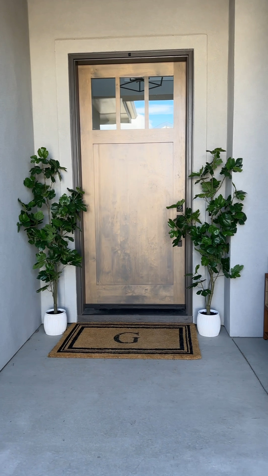 Front porch refresh for spring. The trees come in their own pots. Patio chairs came with cushions, but I like the look without more!