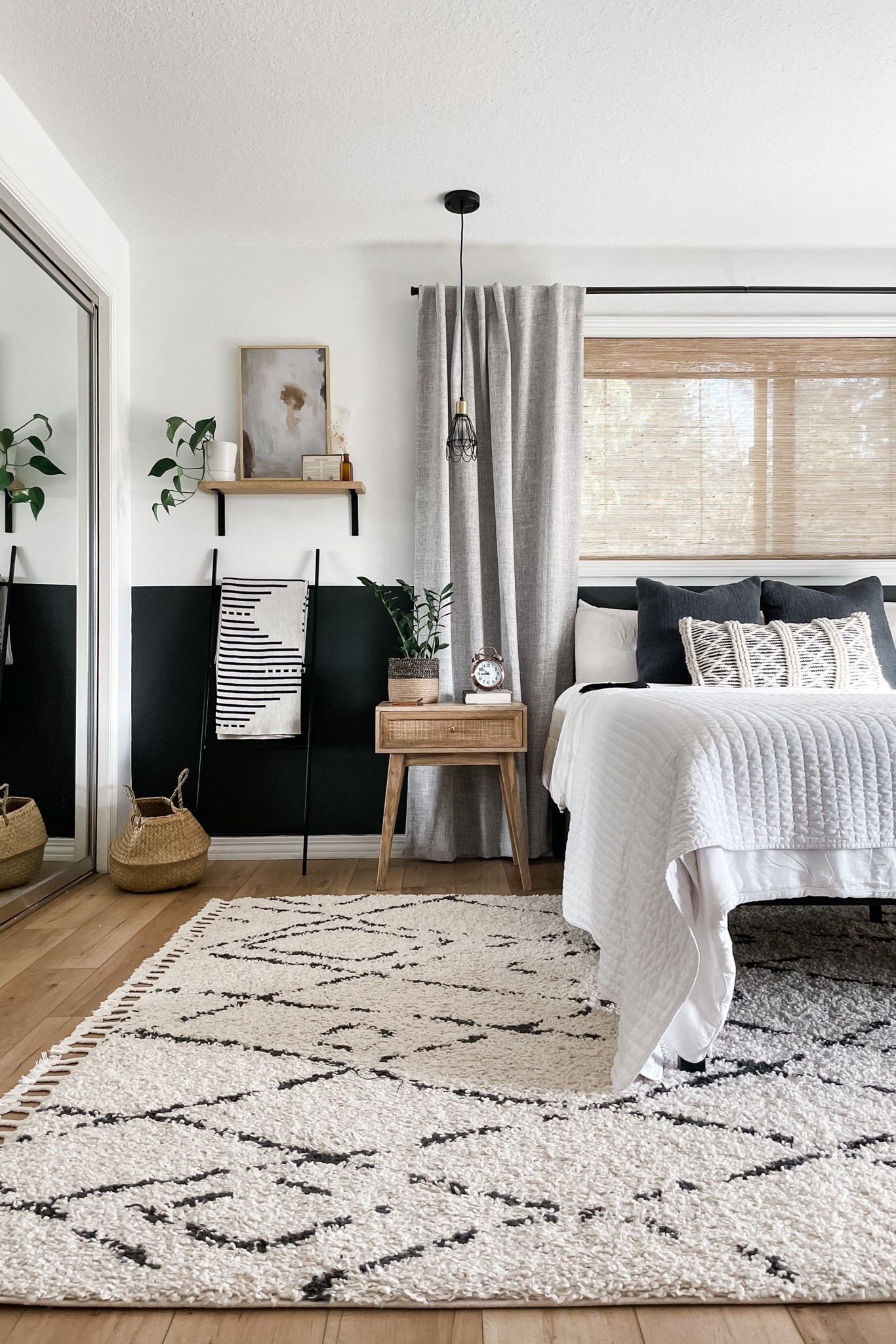 Neutral bedroom decor that’s anything but boring texture and moving materials make it interesting and painted half wall as con contrast. Super simple styling transformed this boring outdated bedroom. Includes woven shades, linen curtains, wall shelf, and geometric rug.

#LTKHome