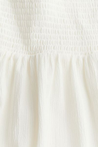 Tie-strap smocked dress - Square neckline - Sleeveless - Cream - Ladies | H&M GB | H&M (UK, MY, IN, SG, PH, TW, HK)